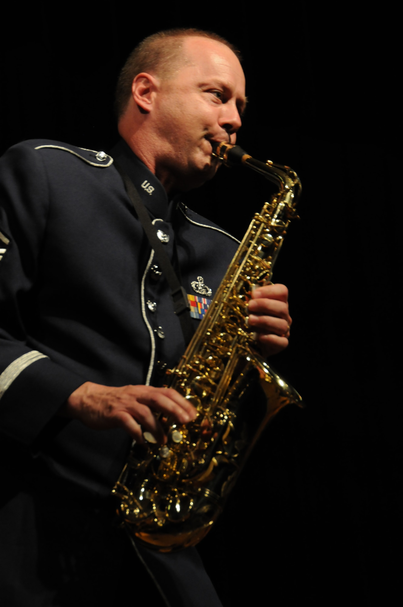 Master Sgt. Stanley George a saxophonist with the 555th Air Force Band performs a solo during the final concert and deactivation ceremony of the 555th Air Force Band, also known as the Triple Nickel and Air National Guard Band of the Great Lakes. The event took place at Anthony Wayne High School, Whitehouse, Ohio, July 7, 2012. The band dating back 1923 will be officially deactivated in 2013 after 90 years of service. (U.S. Air Force photo by Senior Airman Amber Williams/Released)