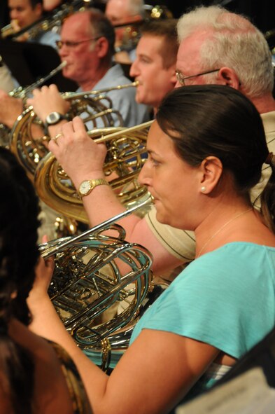 Staff Sgt. Michelle Pohlable plays French Horn during a rehearsal prior to the final performance and deactivation ceremony of the 555th Air Force Band, also known as the Triple Nickel and Air National Guard Band of the Great Lakes. The event took place at Anthony Wayne High School, Whitehouse, Ohio, July 7, 2012. The band dating back 1923 will be officially deactivated in 2013 after 90 years of service. (U.S. Air Force photo by Senior Airman Amber Williams/Released)