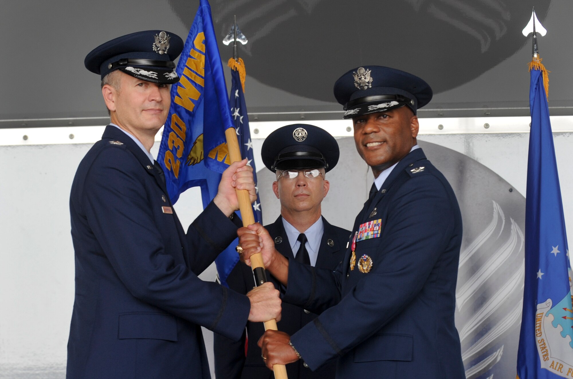 U.S. Air Force Col. Billy Thompson, left, 23d Wing commander, receives the guidon from Col. Neal Robinson, 23d Maintenance Group commander, at Moody Air Force Base, Ga., July 6, 2012. Robinson lead the 23d MXG from Dec. 5, 2009 to July 6, 2012. (U.S. Air Force photo by Airman 1st Class Douglas Ellis/Released)
