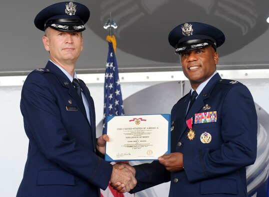 U.S. Air Force Col. Billy Thompson, 23d Wing commander, presents Col. Neal Robinson, 23d Maintenance Group outgoing commander, the Legion of Merit at Moody Air Force Base, Ga., July 6, 2012. Robinson received the award for his outstanding service and leadership as commander of the 23d MXG. (U.S. Air Force photo by Airman 1st Class Douglas Ellis/Released)
