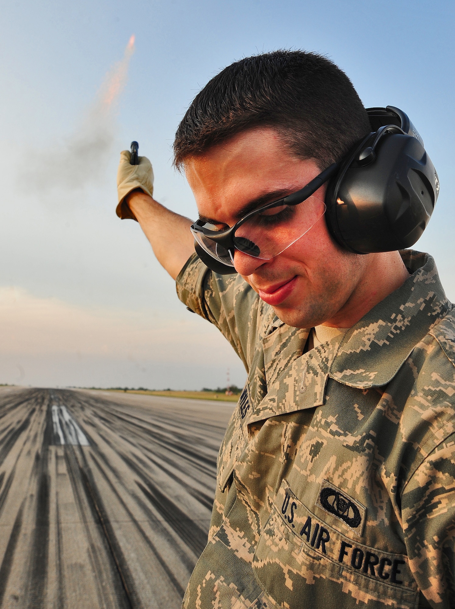 WHITEMAN AIR FORCE BASE, Mo. -- Senior Airman Dennis Myles, 509th Operations Support Squadron airfield management shift lead, shoots pyrotechnics to scare away nearby birds June 30. Airfield managers at Whiteman use two different types of pyrotechnics that have different effects to ensure aircraft are free of “bird strikes” during aircraft landings and take offs. (U.S. Air Force photo/Senior Airman Nick Wilson) (Released)


