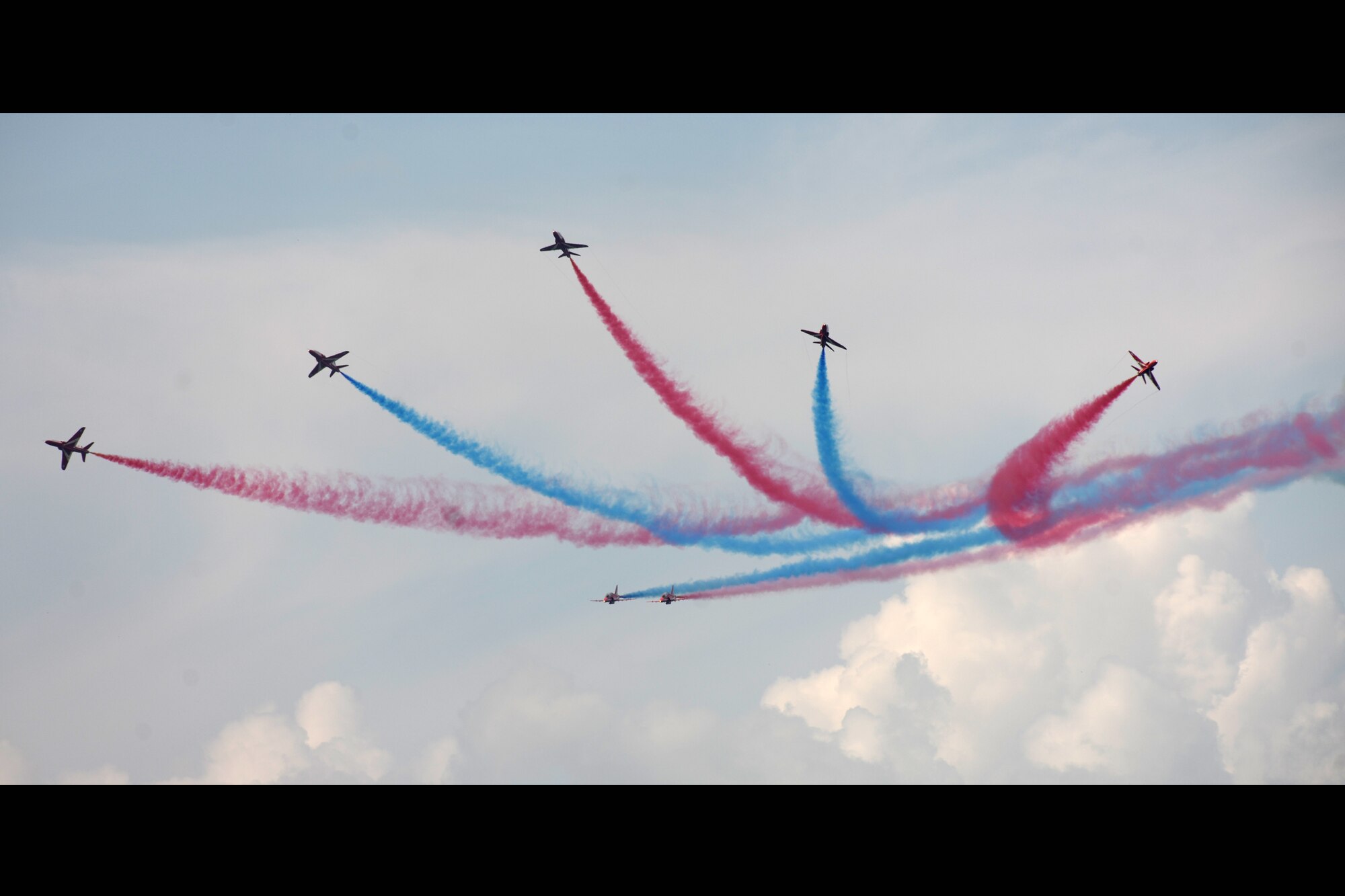 RAF FAIRFORD, United Kingdom - The Royal Air Force Red Arrows perform during the Royal International Air Tattoo here July 8. More than 130,000 people attended the tattoo. (U.S. Air Force photo by Master Sgt. John Barton)