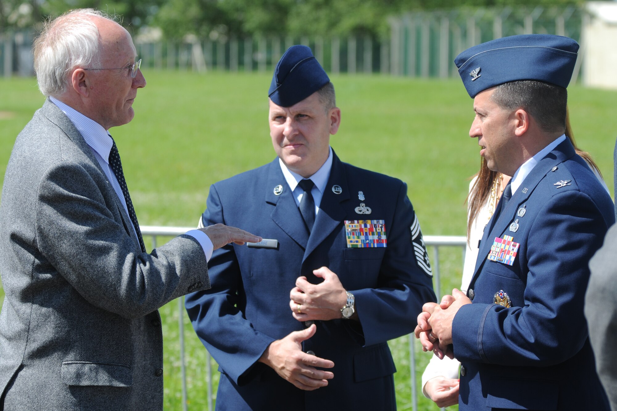 RAF FAIRFORD, United Kingdom - Tim Prince, the Chief Executive Officer of the Royal International Air Tattoo, speaks with Col. Brian Kelly, 501st Combat Support Wing commander, and Chief Master Sgt. Scott Berge, 501st CSW command chief, July 5. (U.S. Air Force photo by Capt. Brian Maguire)