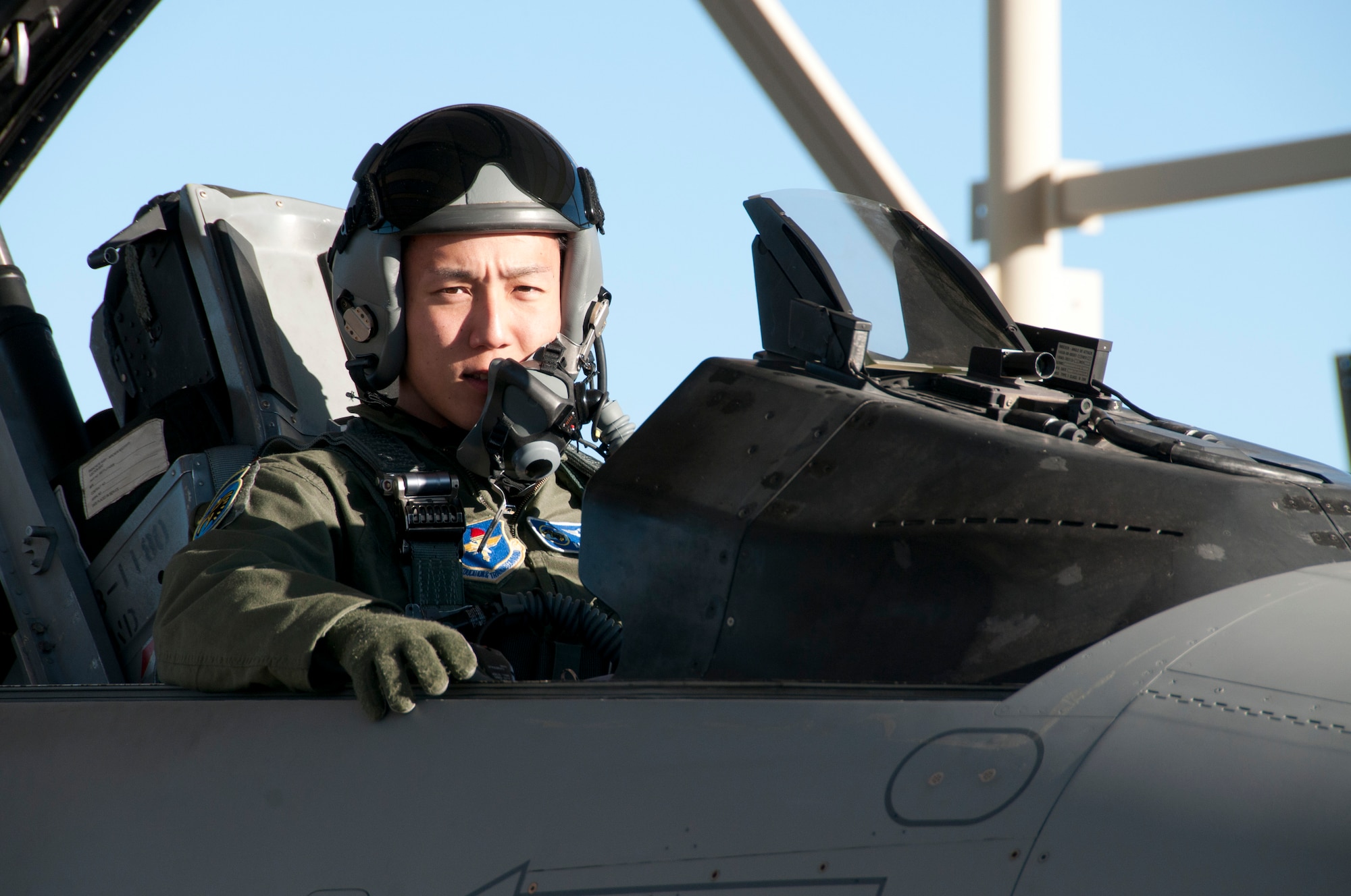 Japan Air Self-Defense Force 1st Lt. Kazuhiro Ota prepares for an F-16 Fighting Falcon training mission on the 162nd Fighter Wing flightline at Tucson International Airport, Feb. 22.  Ota and two other Japanese pilots currently in training here are set to graduate from the Air Guard’s international F-16 school house this fall. (U.S. Air Force photo/Master Sgt. Dave Neve)