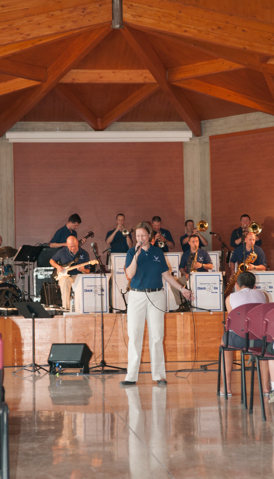 Staff Sgt. Rachel Trimble, vocalist for U.S. Air Forces in Europe band Check Six, performs various songs for children attending the Roveredo in Piano music school July 6 at Roveredo, Italy. Roveredo in Piano was one of four stops by the Check Six band, in an effort to help strengthen the Italian and American partnership. (U.S. Air Force photo/Airman 1st Class Briana Jones)