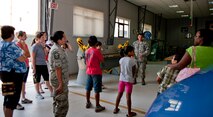 Tech. Sgt. Nicholas Souza, 39th Maintenance Squadron metal maintenance section chief, briefs spouses and children of 39th Air Base Wing Airmen about the metal maintenance flight during a squadron tour July 6, 2012, at Incirlik Air Base, Turkey. The metals section of maintenance is primarily used for metals fabrication to create parts for aircraft. (U.S. Air Force photo by Senior Airman Anthony Sanchelli/Released)
