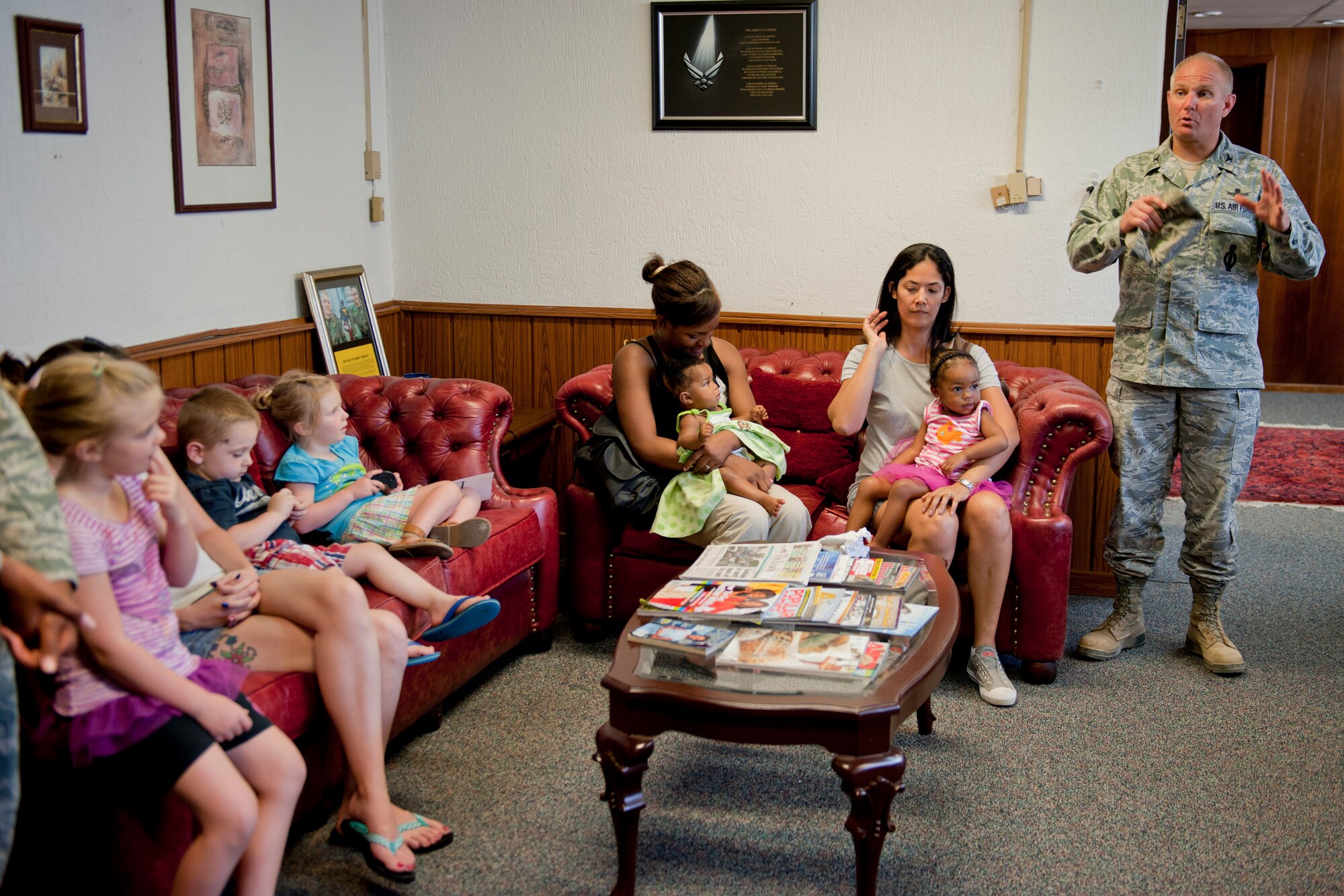 Col. Mark Bowen, 39th Maintenance Squadron commander, right, discusses the 39th MXS mission and tells spouses and children what they can expect to see during a squadron tour July 6, 2012, at Incirlik Air Base, Turkey. The tour was created for family members and friends of 39th MXS Airmen who wished to see and know more about what their loved one does at work. (U.S. Air Force photo by Senior Airman Anthony Sanchelli/Released)