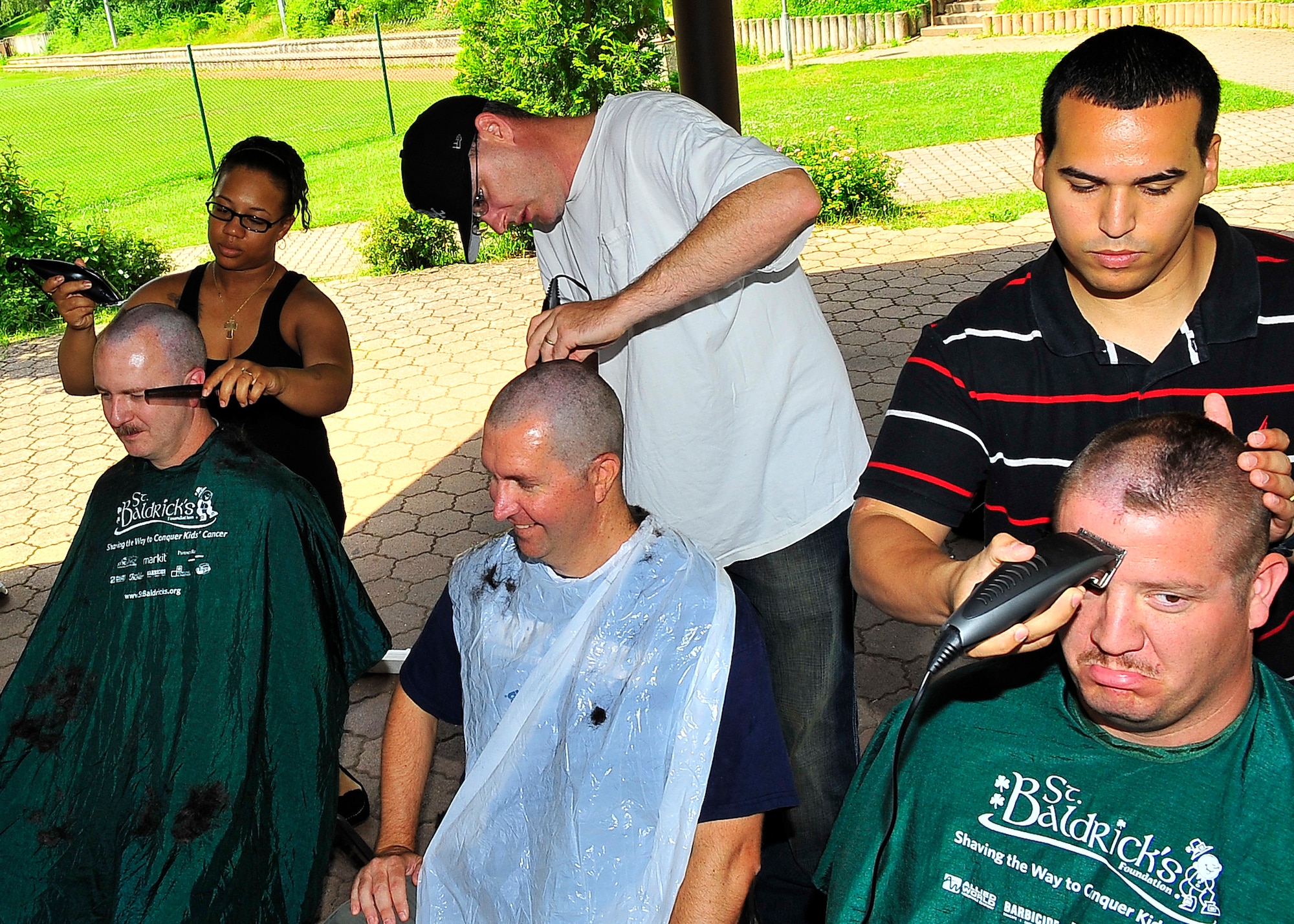 St. Baldrick's Foundation held the third-annual "Shave your head for childhood cancer" event at Donnelly Park on Ramstein Air Base, Germany, June 30, 2012.  More than 80 men and women shaved their heads during the event, generating over $18,000 in donations, surpassing the goal of $15,000. (U.S. Air Force photo/Staff Sgt. Daylena Gonzalez)

