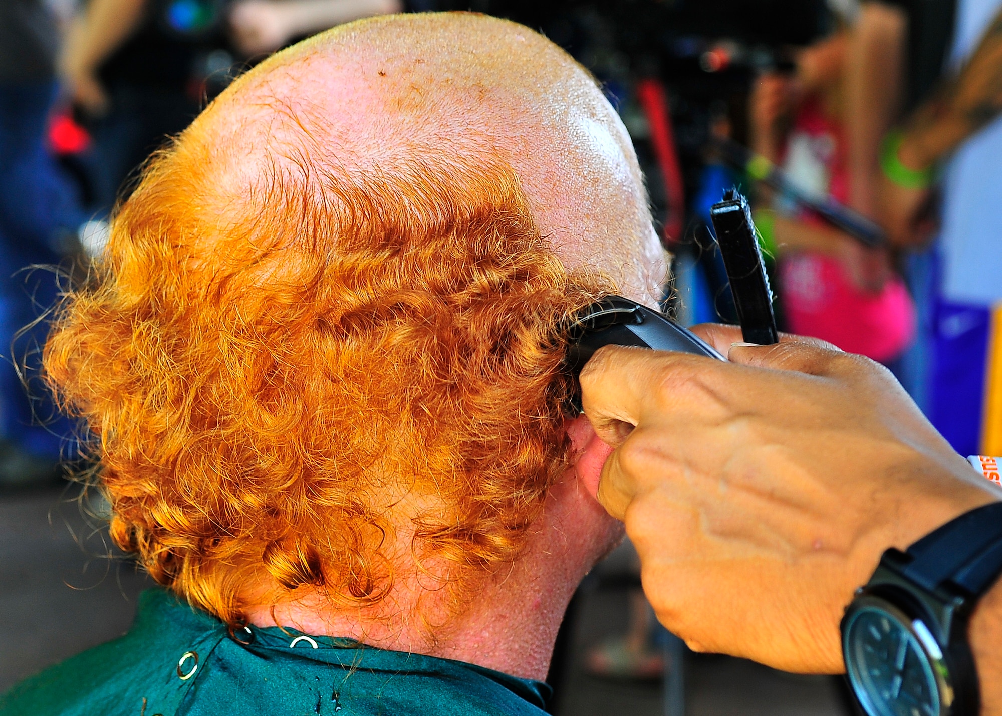 St. Baldrick's Foundation held the third-annual "Shave your head for childhood cancer" event at Donnelly Park on Ramstein Air Base, Germany, June 30, 2012.  More than 80 men and women shaved their heads during the event, generating over $18,000 in donations, surpassing the goal of $15,000. (U.S. Air Force photo/Staff Sgt. Daylena Gonzalez)


