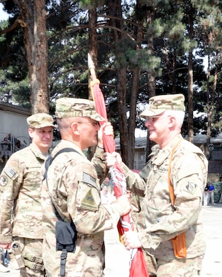 KABUL, Afghanistan — Col. Alfred A. Pantano, Jr. (left), U.S. Army Corps of Engineers Afghanistan Engineer District-North commander, takes the guidon from Maj. Gen. Michael Eyre, commander of the U.S. Army Corps of Engineers Transatlantic Division, at a change of command ceremony here, July 8, 2012. Army Col. Alfred A. Pantano, Jr. accepted command from Col. Christopher W. Martin.

