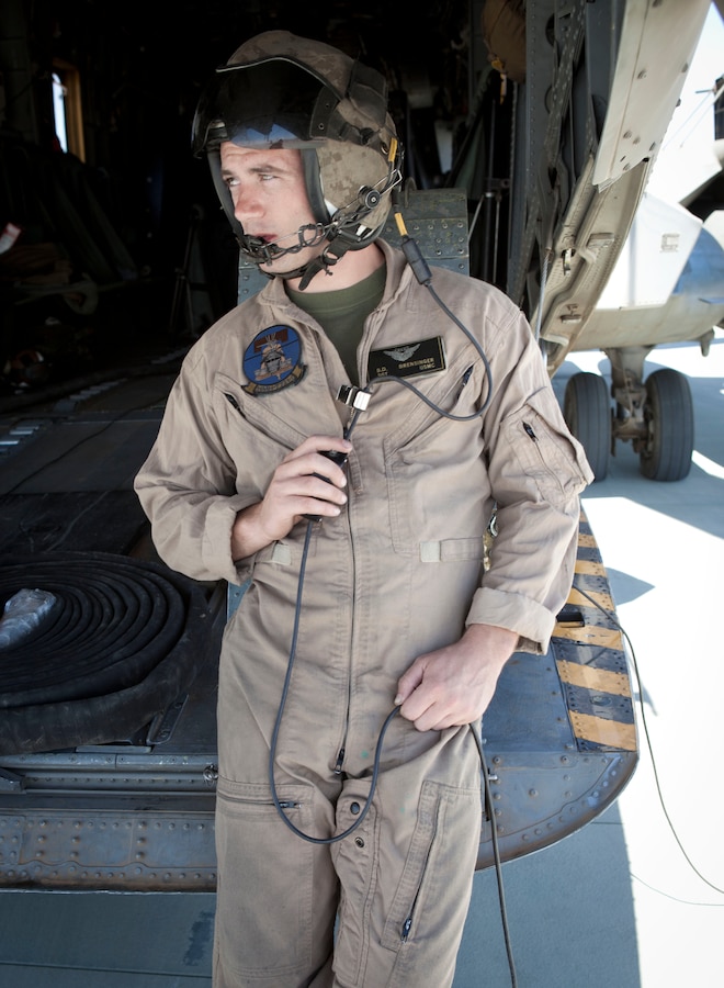 MARINE CORPS AIR GROUND COMBAT CENTER TWENTYNINE PALMS, Calif. -  Sgt. Robert Brensinger, a crew chief with Marine Heavy Helicopter Squadron 772, stands by before commencing a refuel for an AH-1W Super Cobra attack helicopter at the Strategic Expeditionary Landing Field here July 9 during Exercise Javelin Thrust 2012. Javelin Thrust is an annual large scale exercise which allows active and reserve Marines and sailors from 38 different states to train together as a seamless Marine Air Ground Task Force. (Official U.S. Marine Corps photo by Sgt. John M. Odette/Released)