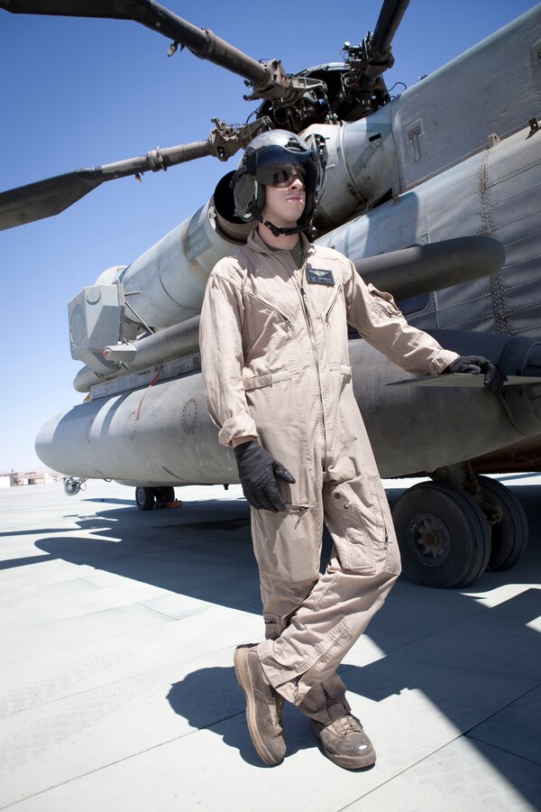 MARINE CORPS AIR GROUND COMBAT CENTER TWENTYNINE PALMS, Calif. -  Cpl. Kevin McClernon, a crew chief with Marine Heavy Helicopter Squadron 772, stands by before commencing a refuel for an AH-1W Super Cobra attack helicopter at the Strategic Expeditionary Landing Field here July 9 during Exercise Javelin Thrust 2012. Javelin Thrust is an annual large scale exercise which allows active and reserve Marines and Sailors from 38 different states to train together as a seamless Marine Air Ground Task Force. (Official U.S. Marine Corps photo by Sgt. John M. Odette/Released)