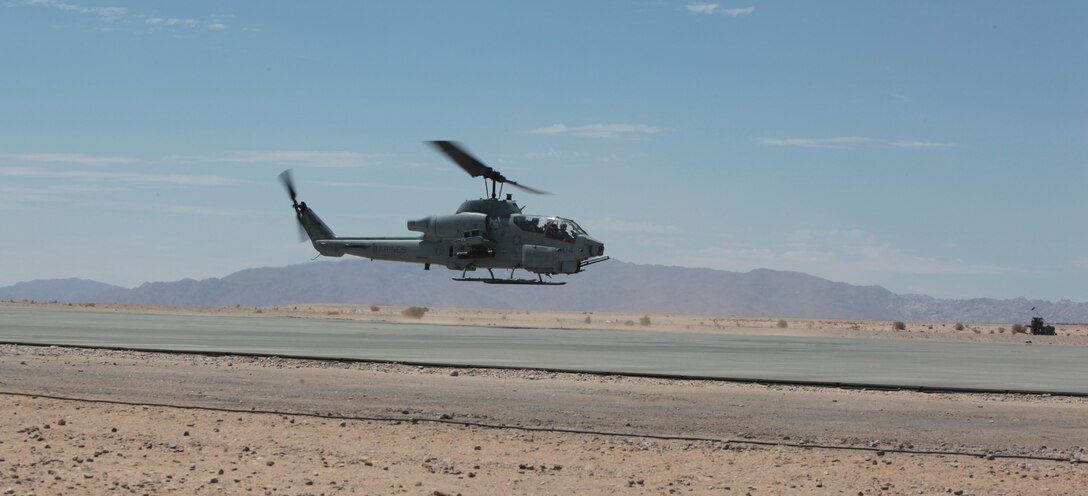 MARINE AIR GROUND COMBAT CENTER TWENTYNINE PALMS, Calif. - An AH-1W Super Cobra helicopter lands to refuel at the Strategic Expeditionary Landing Field here during Exercise Javelin Thrust 2012. Javelin Thrust is an annual large-scale exercise at which allows active and reserve Marines and Sailors from 38 different states to train together as a seamless Marine Air Ground Task Force. (Photo by Sergeant Kevin M. Okamura/Released)