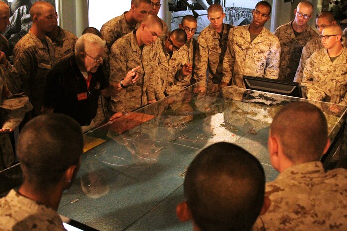 Mike Whaley, docent, Command Museum, points out battles conducted in the Asia-Pacific region to recruits of Company A, 1st Recruit Training Battalion, during their visit to the museum aboard Marine Corps Recruit Depot San Diego June 27. Docents provided recruits with an in-depth history of the Marine Corps from the early ages to the present day. Whaley is a retired Marine lieutenant colonel.
