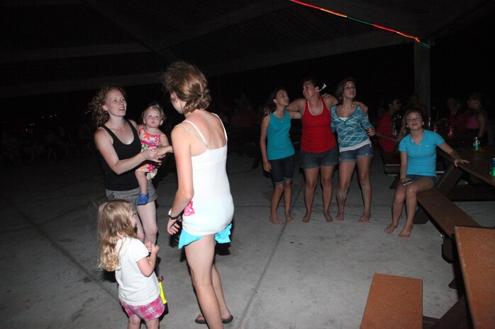 Military families and base patrons danced during the Flashback Fridays classic rock theme event hosted by Marine Corps Community Services at Onslow Beach aboard Marine Corps Base Camp Lejeune July 6. This is the third year MCCS has hosted Flashback Fridays, which is hosted once a month from May through September. 