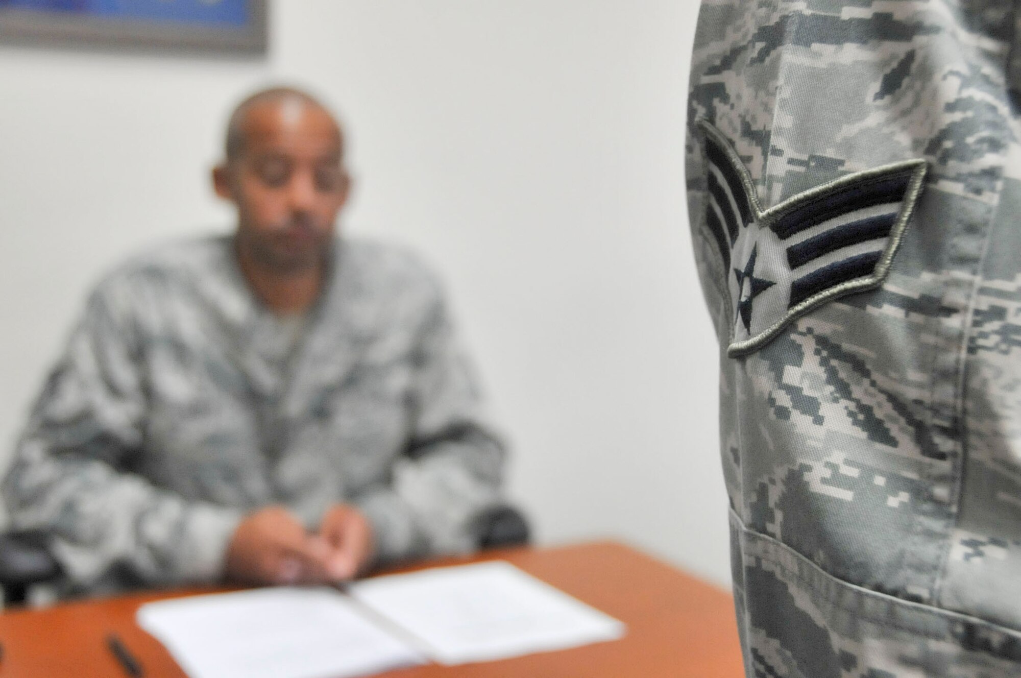 U.S. Air Force Staff Sgt. Carlton Holt, Airmen Leadership School instructor, gives feedback to an ALS student about his briefing June 29, 2012 at Kadena Air Base. The Erwin PME Center is one of seven in the Air Force, and the only one in Pacific Air Force, to test a new ALS curriculum. (U.S. Air Force photo/Staff Sgt. Darnell T. Cannady)