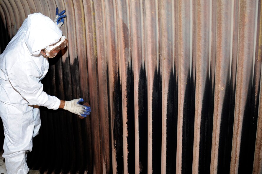 U.S. Air Force Chief Master Sgt. James Laurent, 35th Fighter Wing command chief, assists in an overhaul of the Number 2 boiler at Misawa Air Base, Japan, July 10, 2012. It takes approximately 266 hours to clean one large boiler, which must be accomplished annually. Due to an increased cost in utilities from last year, the base community is asked to keep their thermostats set to 20 C/68 F when at home. (U.S. Air Force photo by Tech. Sgt. Evan Pitcavage)