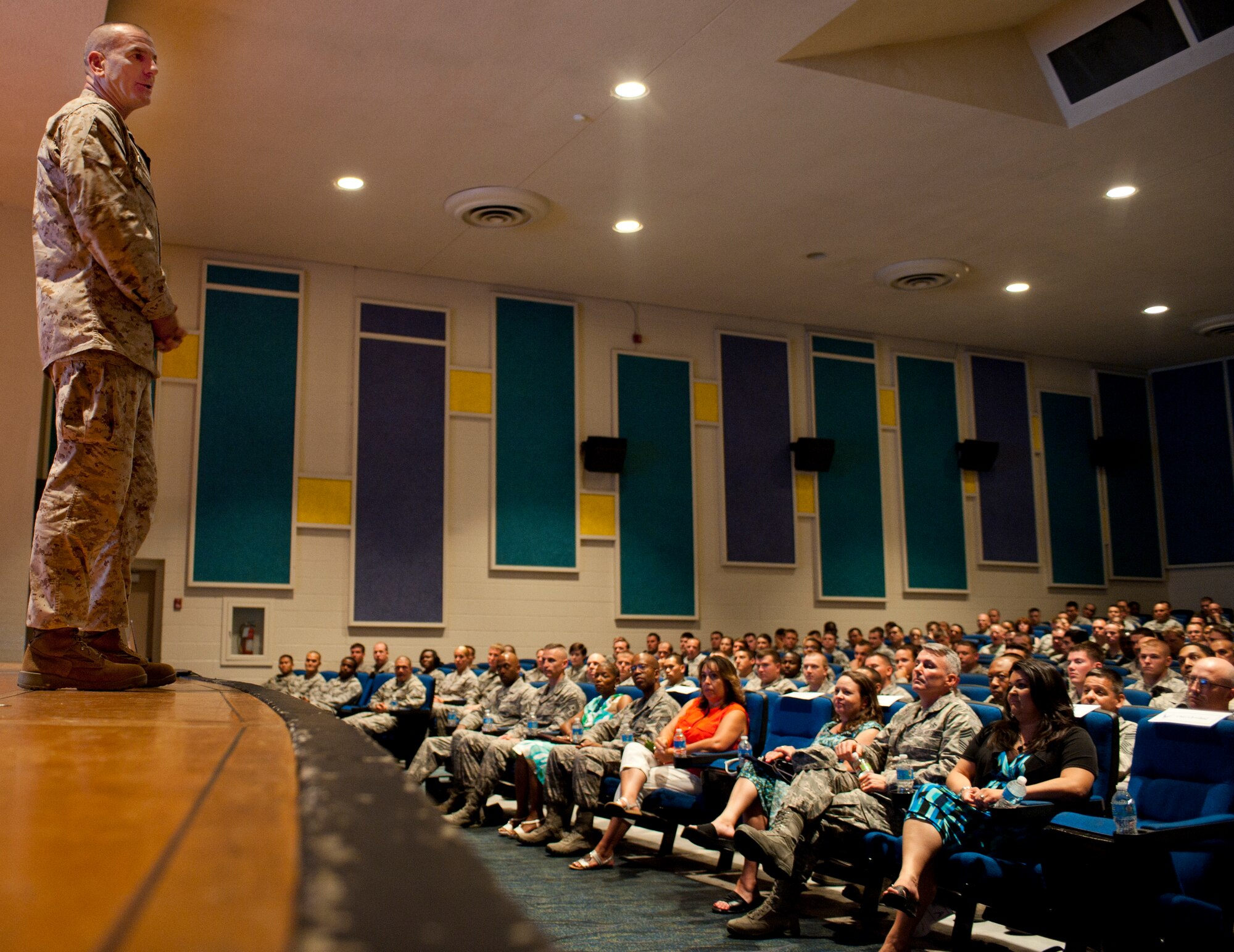 U.S. Marine Corps Sgt. Maj. Bryan B. Battaglia, Senior Enlisted Advisor to the Chairman,Joint Chiefs of Staff, spoke to enlisted Airmen and their spouses about the CJCS' top four priorities for the military enlisted corps July 10, 2012. Battaglia serves as the principal military advisor to the Chairman and the Secretary of Defense on all matters involving joint and combined total force integration, utilization, health of the force and joint development for enlisted personnel. (U.S. Air Force photo by Airman 1st Class Jason Couillard)