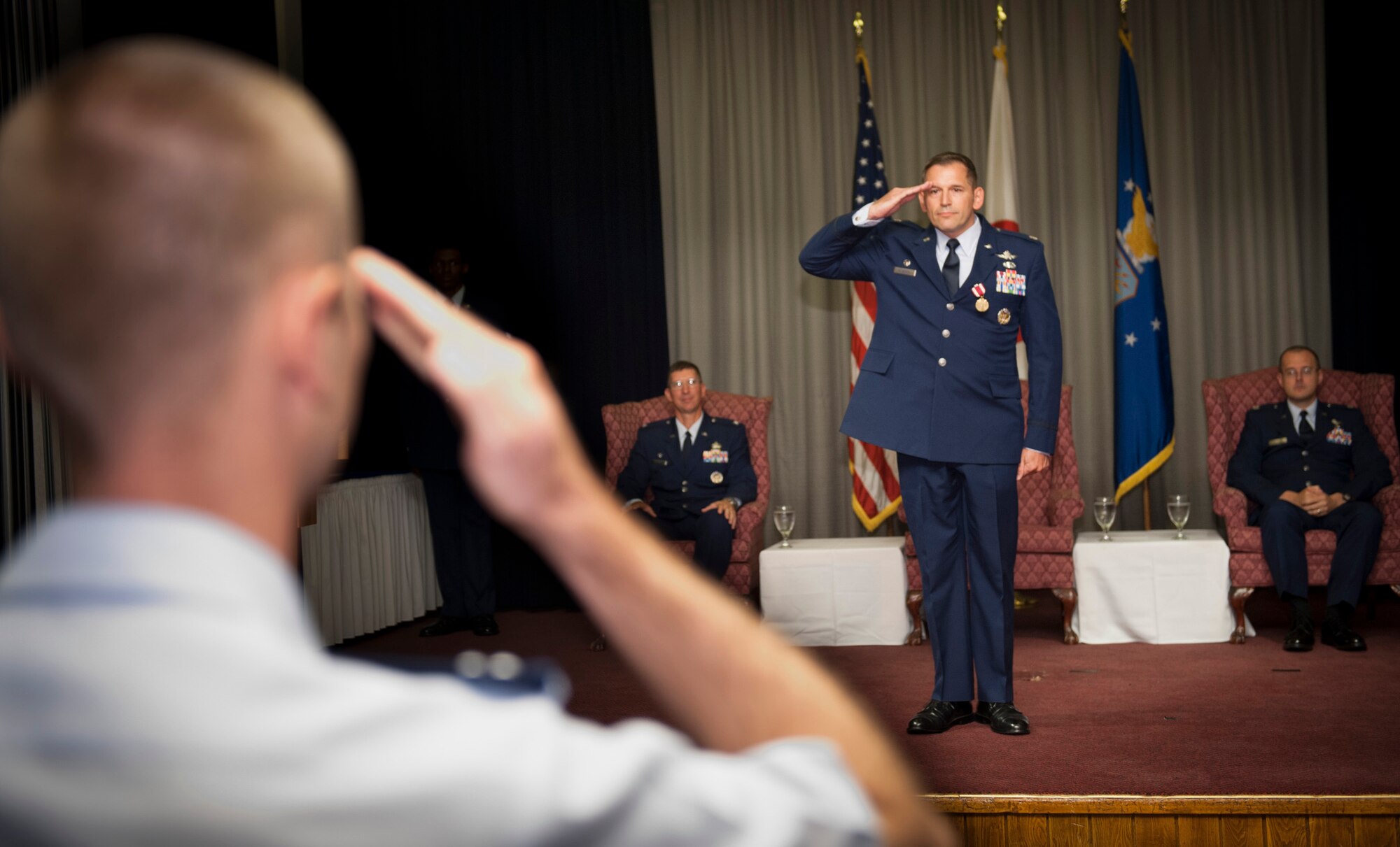 YOKOTA AIR BASE, Japan -- Lt. Col. Rocky Favorito, 374th Communications Squadron outgoing commander, returns his final salute to his unit as its commander during the 374 CS change of command ceremony at Yokota Air Base, Japan, July 6, 2012. The tradition of the military salute can be traced back to medieval knights raising their visors when passing their superiors. This age-old gesture is a universal symbol of mutual respect. (U.S. Air Force photo by Tech. Sgt. Samuel Morse)