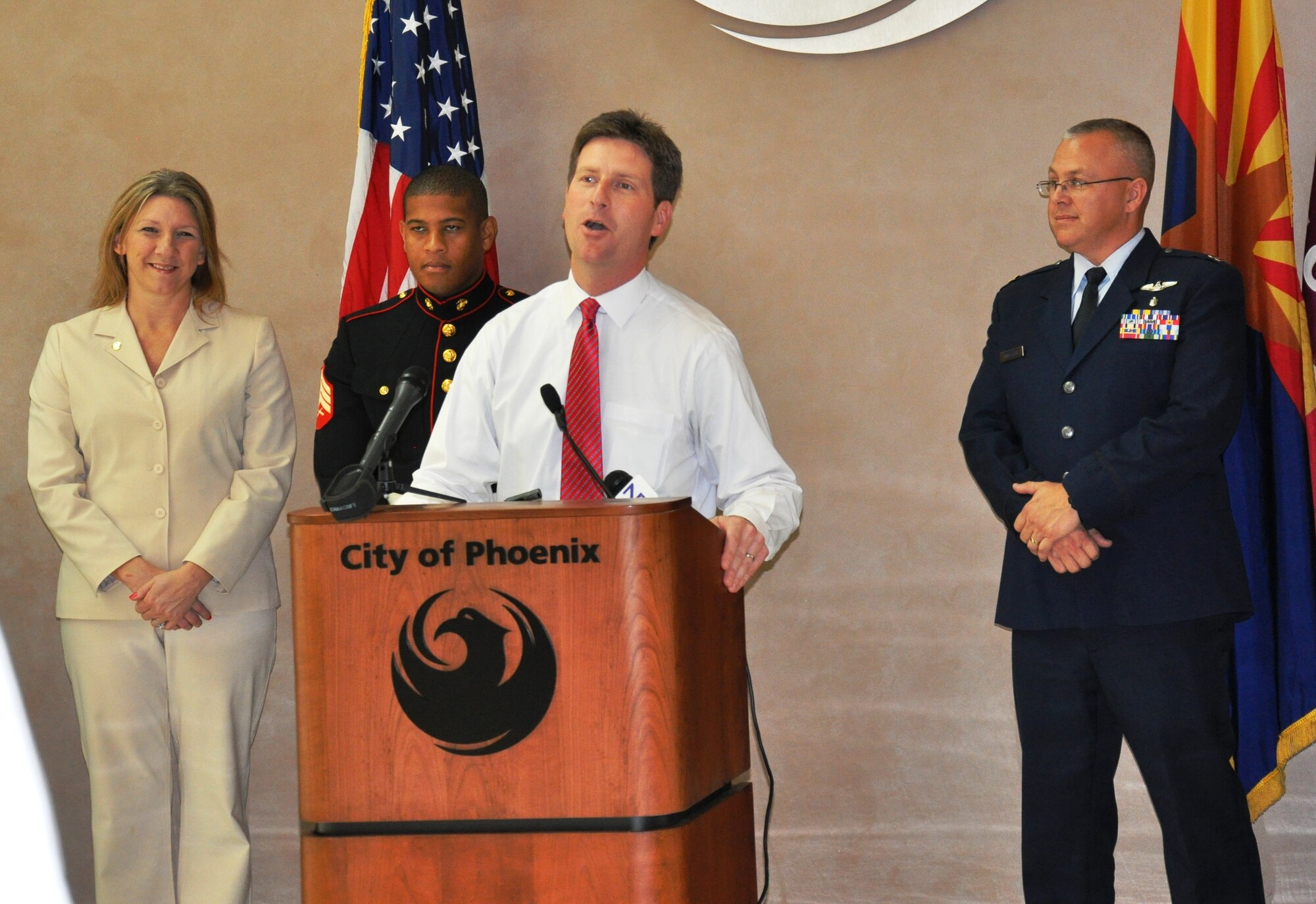 Phoenix Mayor Greg Stanton briefs reporters at a press conference at City Hall July 2 regarding the Arizona Diamondbacks’ Fourth of July military appreciation game. The mayor also recognized Capt. Andrew Hoeffler, a family nurse practitioner with the 56th Medical Group, who successfully resuscitated a drowning victim at the Luke AFB community pool June 23. Hoeffler was one of two Airmen who represented Luke during the pre-game ceremony at the baseball game. (U.S. Air Force photo by Capt. Tristan Hinderliter) 
