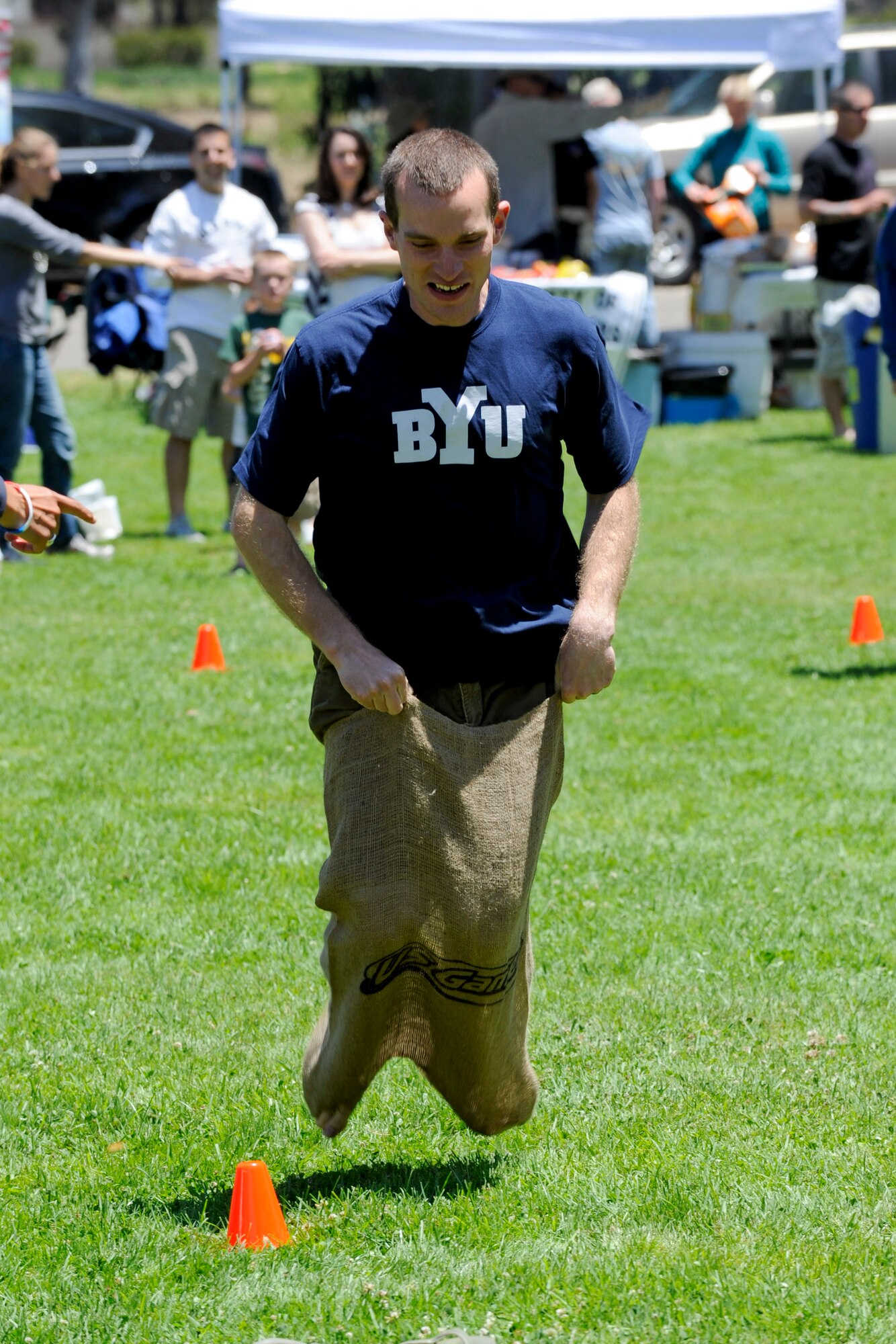 VANDENBERG AIR FORCE BASE, Calif. -- 1st Lt. Matt Folks, a 30th Operations Group range operations commander, competes in a potato sack race during Vandenberg's Independence Day celebration here July 7, 2012. More than 1200 Team V members came to base to celebrate their nations independence. (U.S. Air Force photo/Staff Sgt. Levi Riendeau)