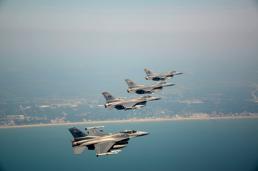 SHAW AIR FORCE BASE, S.C. - Four F-16 Vipers assigned to the 20th Fighter Wing, Shaw Air Force Base, S.C. fly over the South Carolina coast as part of the Salute From the Shore tribute on July 4, 2012. Supporters of the U.S. military gathered along the Carolina coastline on Independence day and showed their support by building large flags and signs and cheered as Lt. Col Jason Plourde, Capt. Josh D. Larsen, Capt. Luke A. Bledsoe and Capt. John D. Ryan flew over head in their F-16s. (U.S.  Air Force photo by Master Sgt. Cohen A. Young/Released)