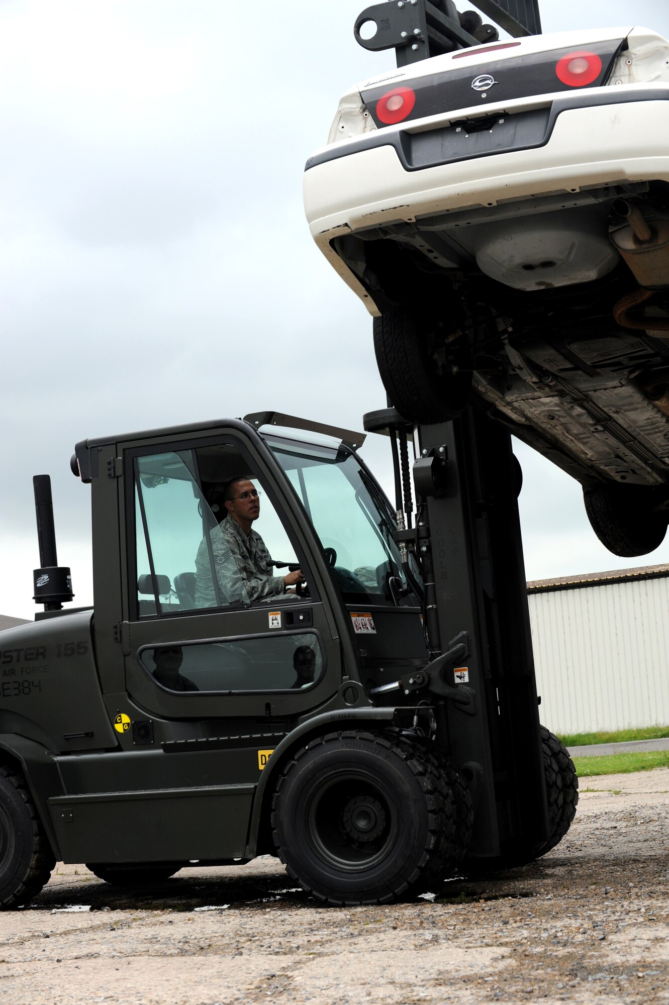 RAF MILDENHALL, England -- Staff Sgt. Phillip Householder,  442nd Logistics Readiness Squadron vehicle operator, recovers a rolled-oved vehicle during an exercise, July 5, 2012. Householder, along with approximately 50 other reservists from the squadron, were deployed here for training. The 442nd LRS is part of the 442nd Fighter Wing, an A-10 Thunderbolt II Air Force Reserve unit at Whiteman Air Force Base, Mo. (U.S. Air Force photo/Staff Sgt. Danielle Johnston)