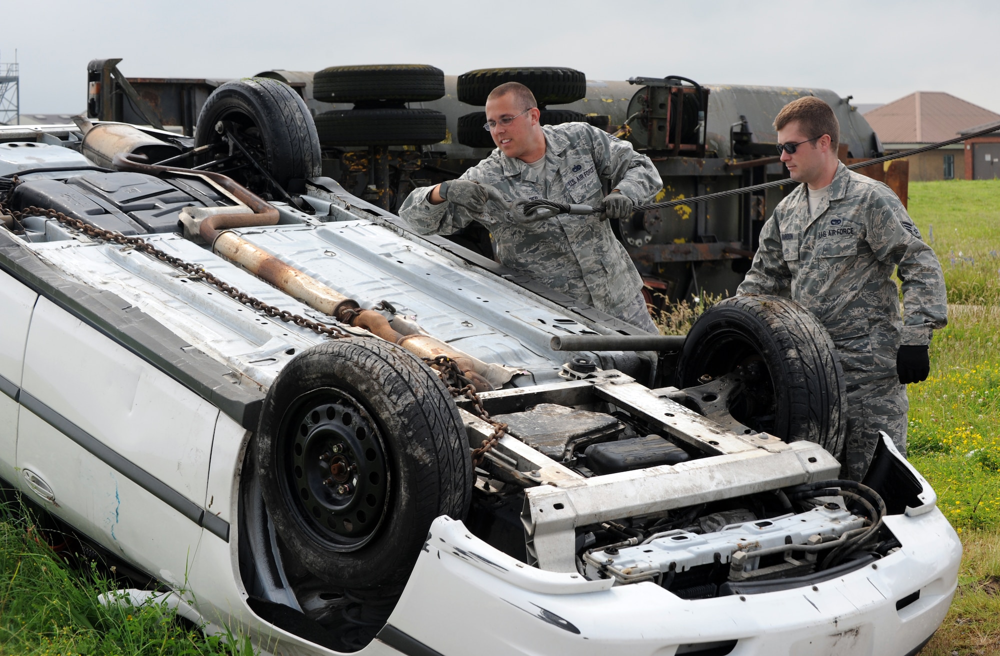 RAF MILDENHALL, England -- Staff Sgt. Phillip Householder, 442nd Logistics Readiness Squadron vehicle operator, recovers a rolled-oved vehicle during an exercise, July 5, 2012. Householder, along with approximately 50 other reservists from the squadron, was deployed here for training. The 442nd LRS is part of the 442nd Fighter Wing, an A-10 Thunderbolt II Air Force Reserve unit at Whiteman Air Force Base, Mo. (U.S. Air Force photo/Staff Sgt. Danielle Johnston)