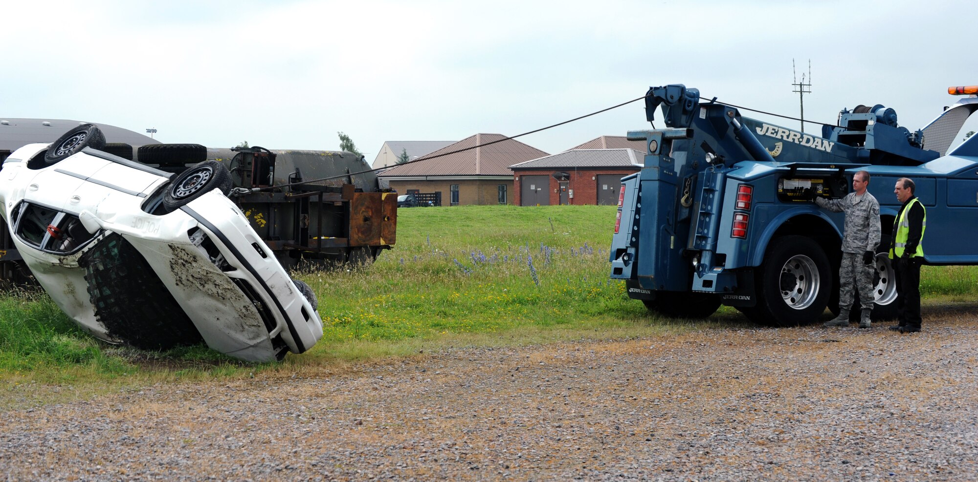 RAF MILDENHALL, England -- Tech. Sgt. Josh Burr, 442nd Logistics Readiness Squadron vehicle operator, recovers a rolled-oved vehicle during an exercise, July 5, 2012. Burr, along with approximately 50 other reservists from the squadron, was deployed here for training. The 442nd LRS is part of the 442nd Fighter Wing, an A-10 Thunderbolt II Air Force Reserve unit at Whiteman Air Force Base, Mo. (U.S. Air Force photo/Staff Sgt. Danielle Johnston)