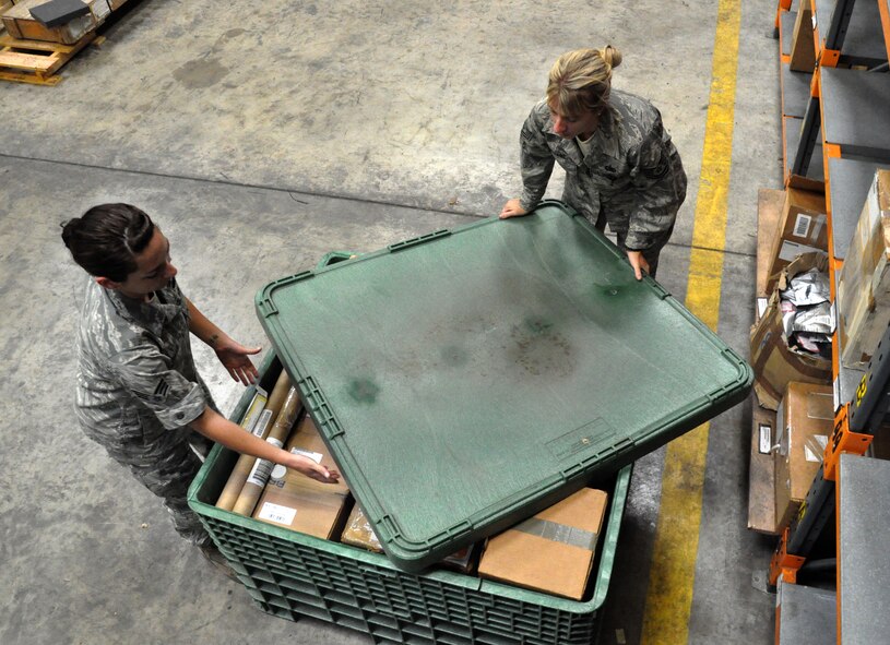 RAF MILDENHALL, England -- Airman 1st Class Tiffany Loman and Tech. Sgt. Courtney Stuart, 442nd Logistics Readiness Squadron supply technicians, move aircraft parts to a new facility, July 2, 2012. Loman and Stuart, along with approximately 50 other reservists from the squadron, was deployed here for training. The 442nd LRS is part of the 442nd Fighter Wing, an A-10 Thunderbolt II Air Force Reserve unit at Whiteman Air Force Base, Mo. (U.S. Air Force photo/Staff Sgt. Danielle Johnston)