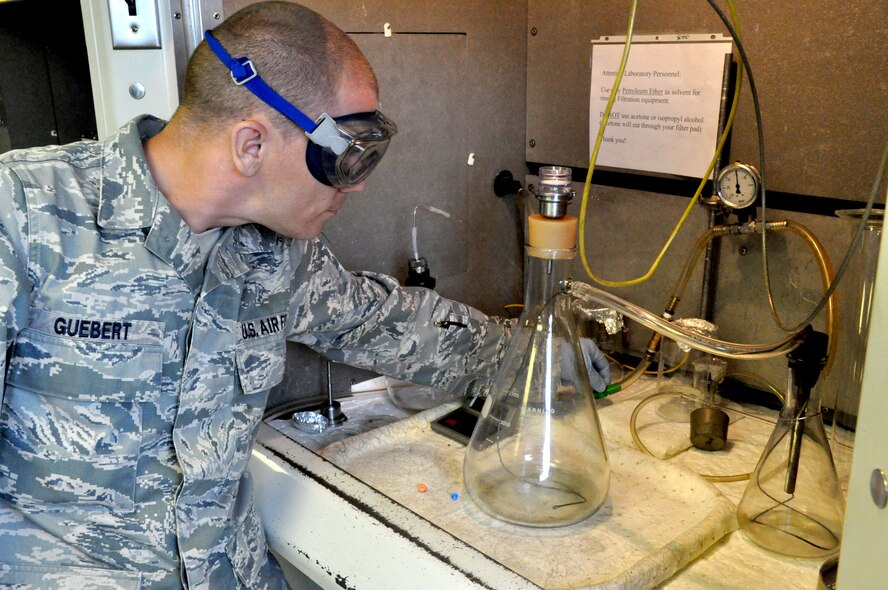 RAF MILDENHALL, England -- Tech. Sgt. Gregory S. Guebert, 442nd Logistics Readiness Squadron fuels technician, test fuel samples, June 30, 2012. Guebert, along with approximately 50 other reservists from the squadron, was deployed here for training. The 442nd LRS is part of the 442nd Fighter Wing, an A-10 Thunderbolt II Air Force Reserve unit at Whiteman Air Force Base, Mo. (U.S. Air Force photo/Staff Sgt. Danielle Johnston)