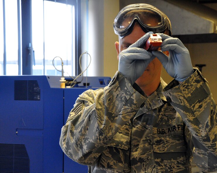 RAF MILDENHALL, England -- Tech. Sgt. Gregory S. Guebert, 442nd Logistics Readiness Squadron fuels technician, test fuel samples, June 30, 2012. Guebert, along with approximately 50 other reservists from the squadron, was deployed here for training. The 442nd LRS is part of the 442nd Fighter Wing, an A-10 Thunderbolt II Air Force Reserve unit at Whiteman Air Force Base, Mo. (U.S. Air Force photo/Staff Sgt. Danielle Johnston)