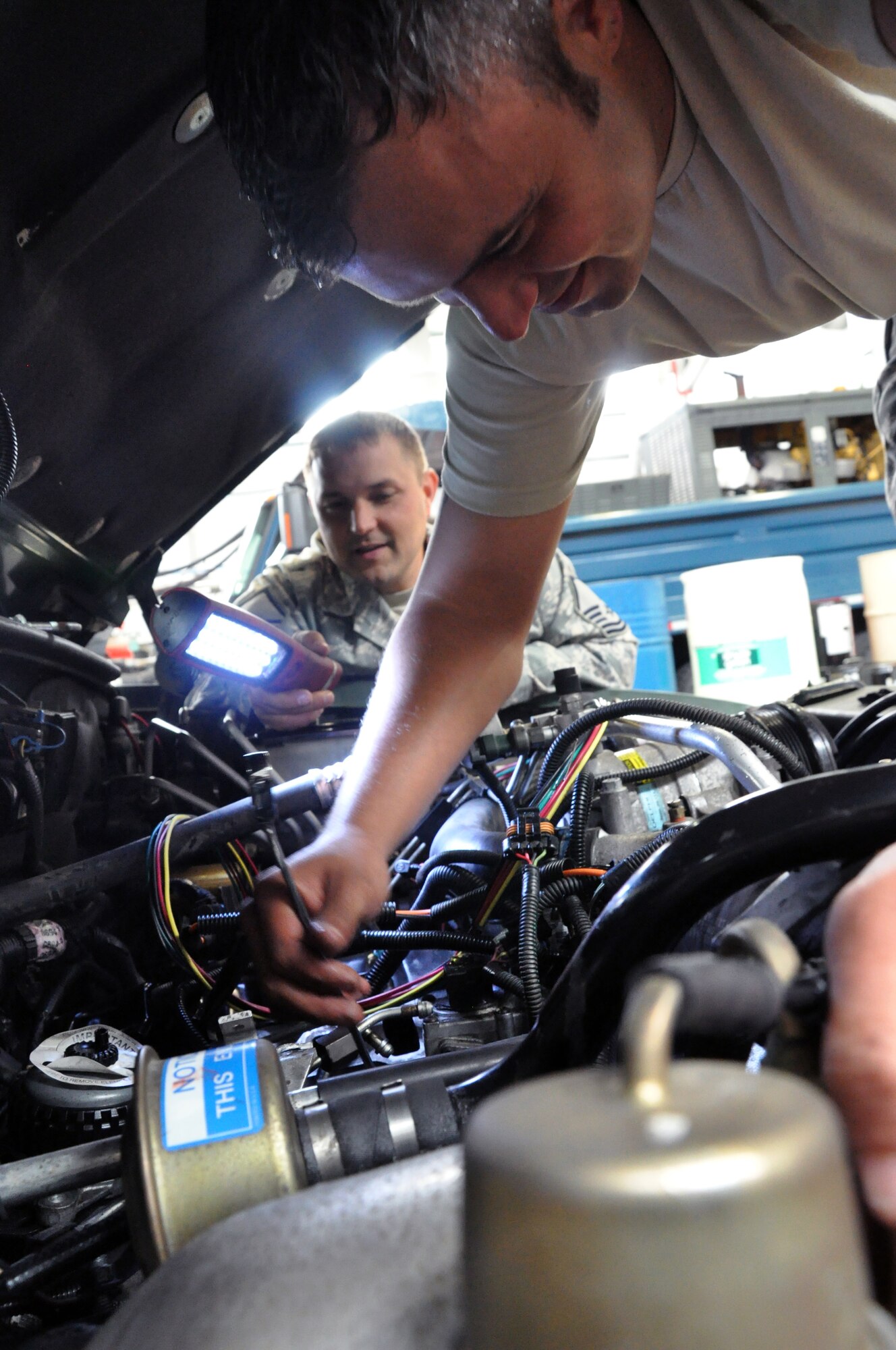 RAF MILDENHALL, England -- Senior Airman Rob Thomas, 442nd Logistics Readiness Squadron vehicle maintainer, fixes a vehicle previously deemed as terminal, June 26, 2012. Thomas, along with approximately 50 other reservists from the squadron, was deployed here for training. The 442nd LRS is part of the 442nd Fighter Wing, an A-10 Thunderbolt II Air Force Reserve unit at Whiteman Air Force Base, Mo. (U.S. Air Force photo/Staff Sgt. Danielle Johnston)