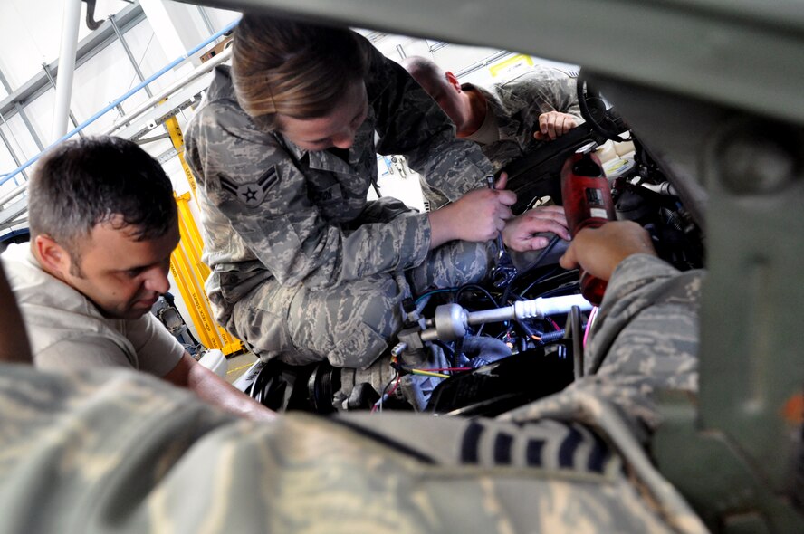 RAF MILDENHALL, England -- Airman 1st Class Brittany Simpson, 442nd Logistics Readiness Squadron vehicle maintainer, fixes a vehicle previously deemed as terminal, June 26, 2012. Simpson, along with approximately 50 other reservists from the squadron, was deployed here for training. The 442nd LRS is part of the 442nd Fighter Wing, an A-10 Thunderbolt II Air Force Reserve unit at Whiteman Air Force Base, Mo. (U.S. Air Force photo/Staff Sgt. Danielle Johnston)