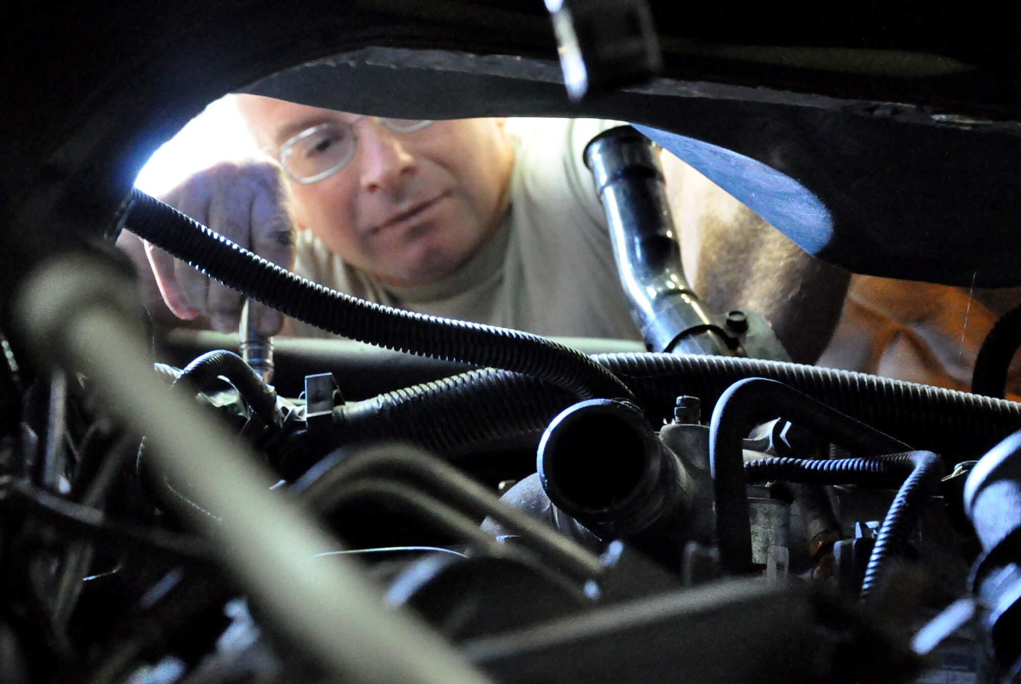 RAF MILDENHALL, England -- Staff Sgt. Eric Harris, 442nd Logistics Readiness Squadron vehicle maintainer, canibalizes a part for use in another vehicle, June 26, 2012. Harris, along with approximately 50 other reservists from the squadron, was deployed here for training. The 442nd LRS is part of the 442nd Fighter Wing, an A-10 Thunderbolt II Air Force Reserve unit at Whiteman Air Force Base, Mo. (U.S. Air Force photo/Staff Sgt. Danielle Johnston)