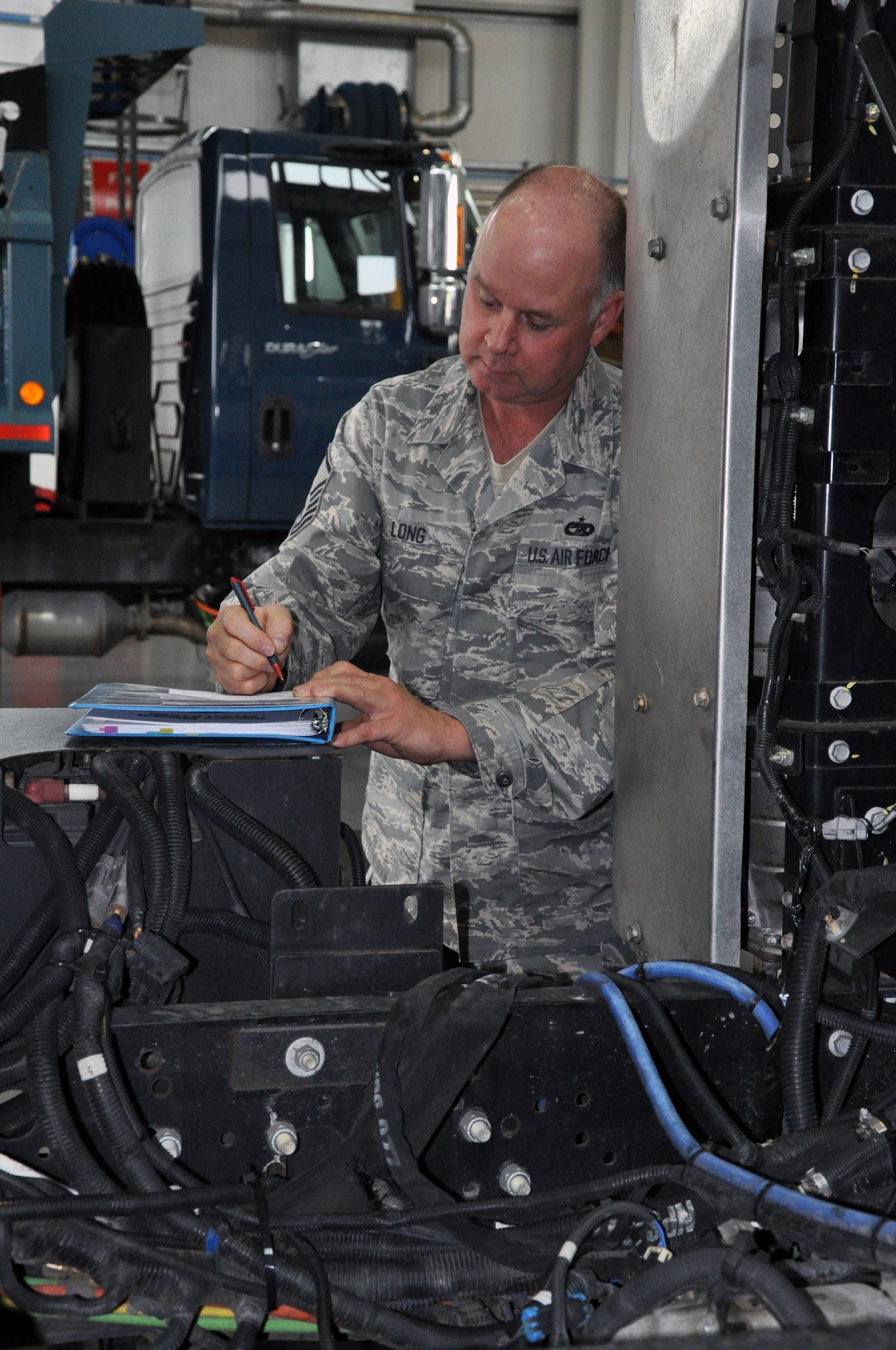 RAF MILDENHALL, England -- Master Sgt. Jeff Long, 442nd Logistics Readiness Squadron vehicle maintainer, writes down a part number prior to putting in an order, June 26, 2012. Long, along with approximately 50 other reservists from the squadron, was deployed here for training. The 442nd LRS is part of the 442nd Fighter Wing, an A-10 Thunderbolt II Air Force Reserve unit at Whiteman Air Force Base, Mo. (U.S. Air Force photo/Staff Sgt. Danielle Johnston)