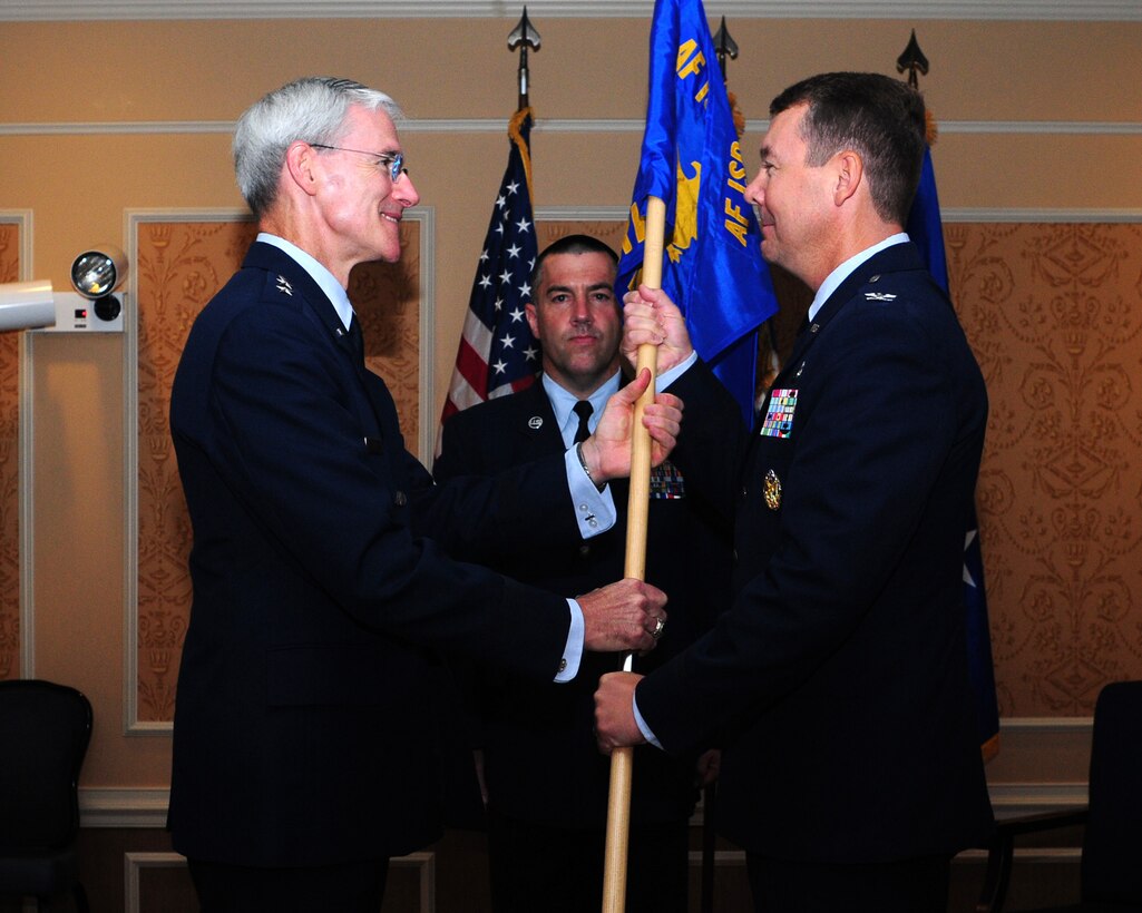 U.S. Air Force Col. Jeffrey Kruse receives the 480th Intelligence Surveillance and Reconnaissance Wing guidon from Maj. Gen. Robert Otto, Air Force ISR Agency commander, during a change of command ceremony, July 10, 2012, at Langley Air Force Base, Va. Kruse, who recently served as the wing commander of the 361st ISR wing at Hurlburt Field, Fla., succeeds Col. Paul Nelson, who will move on to become the AFISR agency vice commander. (U.S Air Force photo by Airman 1st Class Brian Kelly/Released)
