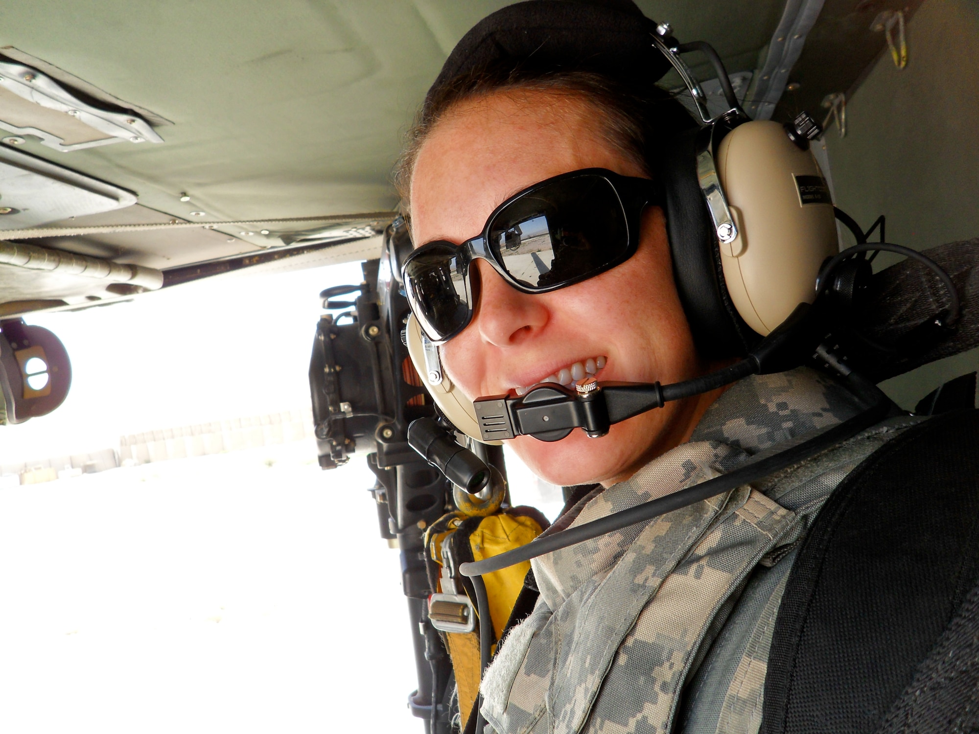 Capt. Jennifer Mitchum, 20th Medical Operations Squadron clinic nurse and flight chief at the Family Health Clinic, flies on a orientation with the medical evacuation team at Combat Outpost Khilagay, Afghanistan, July 23, 2011. Mitchum would go on MEDEVAC missions with critical patients. They saw over 350 trauma patients and preformed approximately 90 medical evacuations. (Courtesy photo)