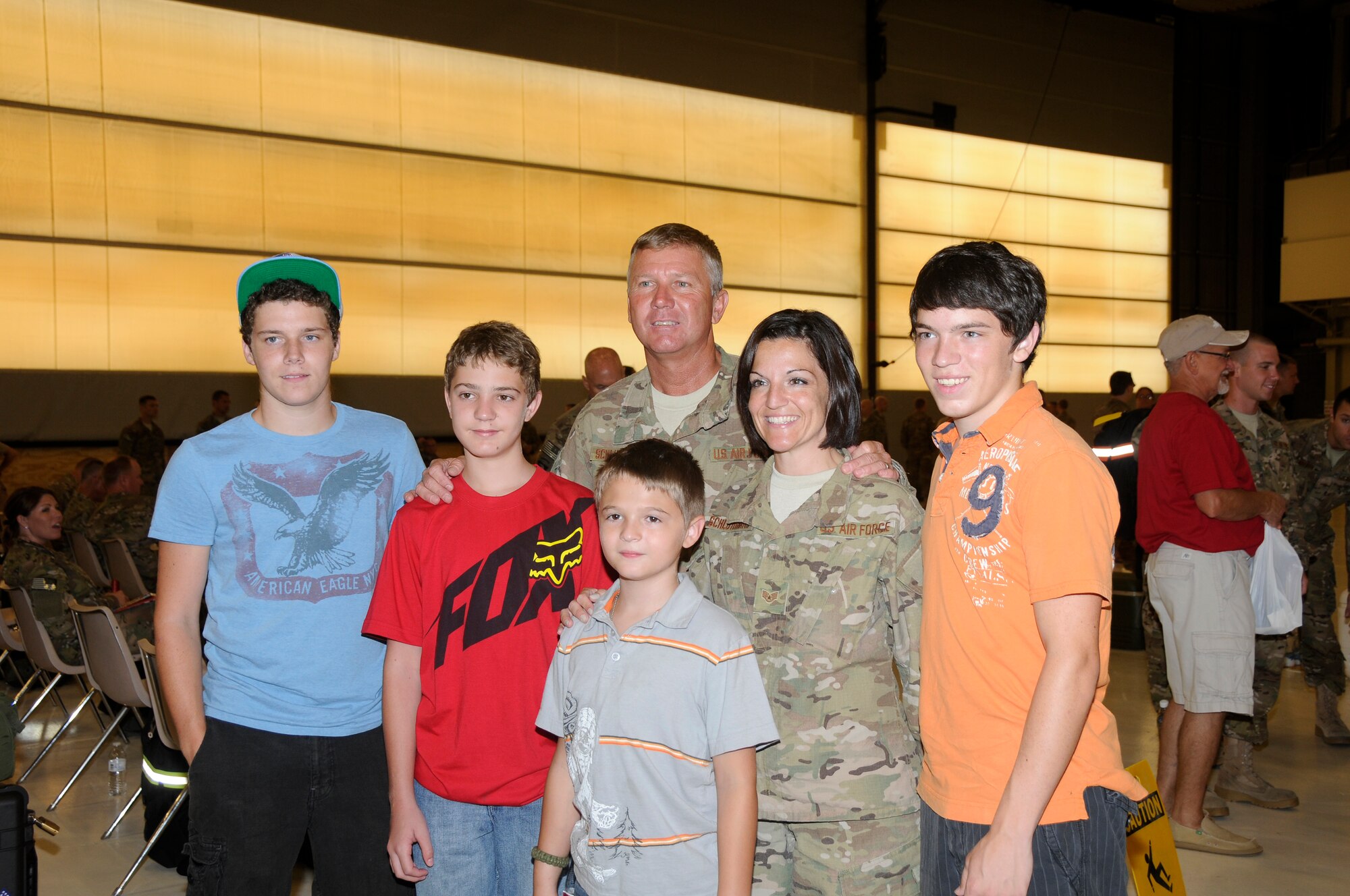 Staff Sgt. Shilo Schluterman and her husband, Senior Master Sgt. Walter Schluterman, enjoy time with their children before departing Fort Smith, Ark., July 2 for Bagram Air Base in Afghanistan, where they will be deployed for about three months in support of Operation Enduring Freedom. The Schlutermans along with 275 Airmen with the 188th deployed to Afghanistan July 2. (National Guard photo by Airman 1st Class Hannah Landeros/188th Fighter Wing Public Affairs)
