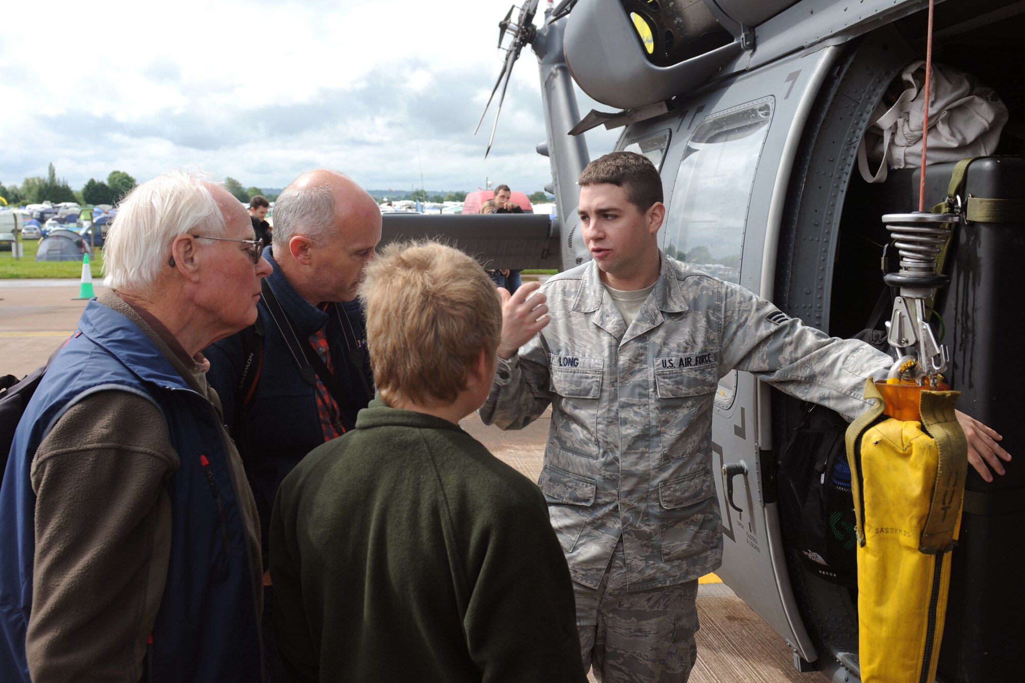 RAF FAIRFORD, United Kingdom - Senior Airman Kenneth Long talks about the capabilities of the HH-60 Pave Hawk during the Royal International Air Tattoo July 7. Long is assigned to the 748th Aircraft Maintenance Squadron at RAF Lakenheath, United Kingdom. (U.S. Air Force photo by Capt. Brian Maguire)