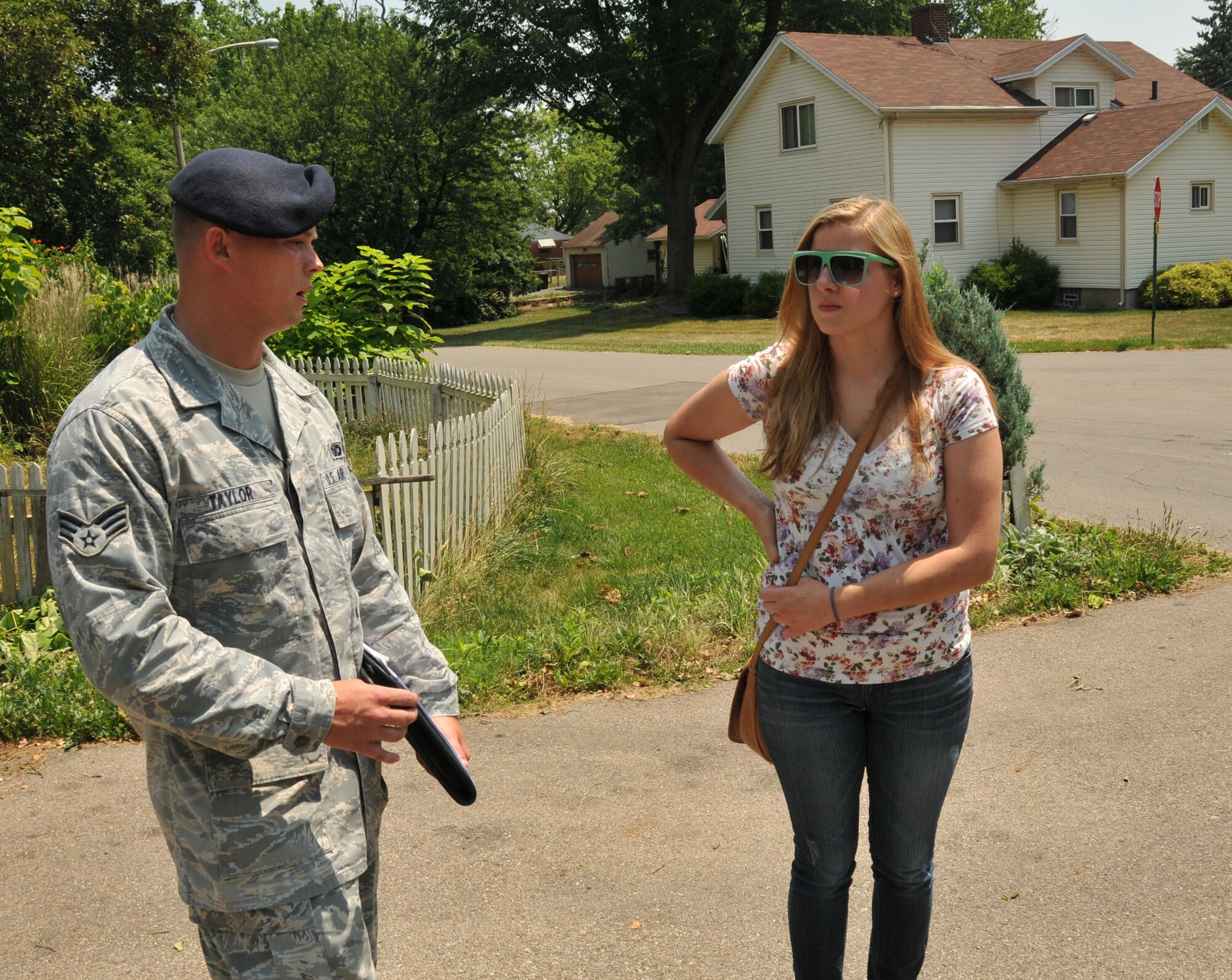 Senior Airman Jeremiah Taylor, 178th Security Forces Squadron , Ohio Air National Guard, checks on the health and welfare of residents in Montgomery County, Ohio June 2, 2012 in response to recent storm damages. The storm left thousands without power and Ohio Governor John Kasich declared a state of emergency calling upon the Ohio Air and Army National Guard to assist those in need.