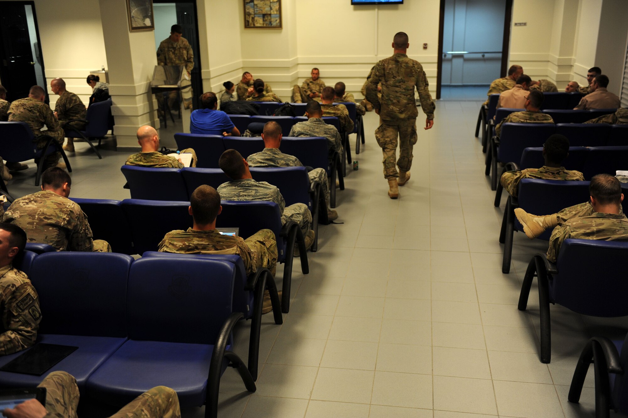 Service members await their flight at the Incirlik passenger terminal July 10, 2012, at Incirlik Air Base, Turkey. The 728th Air Mobility Squadron is at the frontline of efforts to deliver service members and lifesaving cargo to several key locations across Eastern Europe, Southwest and Central Asia, and parts of Northern Africa. (U.S. Air Force photo by Senior Airman Jarvie Z. Wallace/Released)