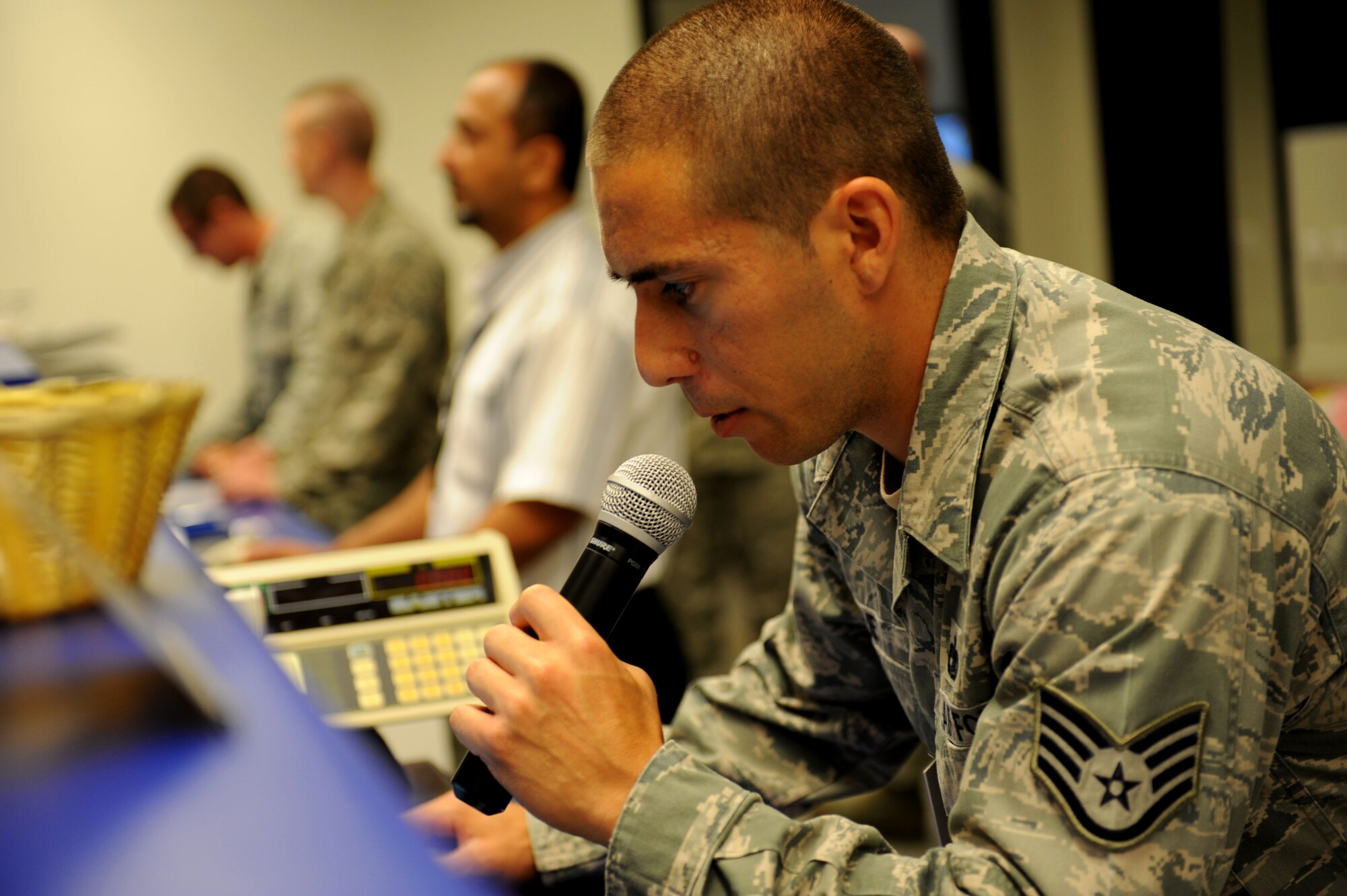 Staff Sgt. Gregory Viruet, 728th Air Mobility Squadron passenger service supervisor, performs roll call at the Incirlik passenger terminal July 10, 2012, at Incirlik Air Base, Turkey. The 728th AMS is a tenant unit to the 39th Air Base Wing and consists of approximately 300 permanent-party Airmen, deployed Airmen and Turkish nationals, as well as an additional 50 Airmen at the Transit Center at Manas, Kyrgyzstan. (U.S. Air Force photo by Senior Airman Jarvie Z. Wallace/Released)
