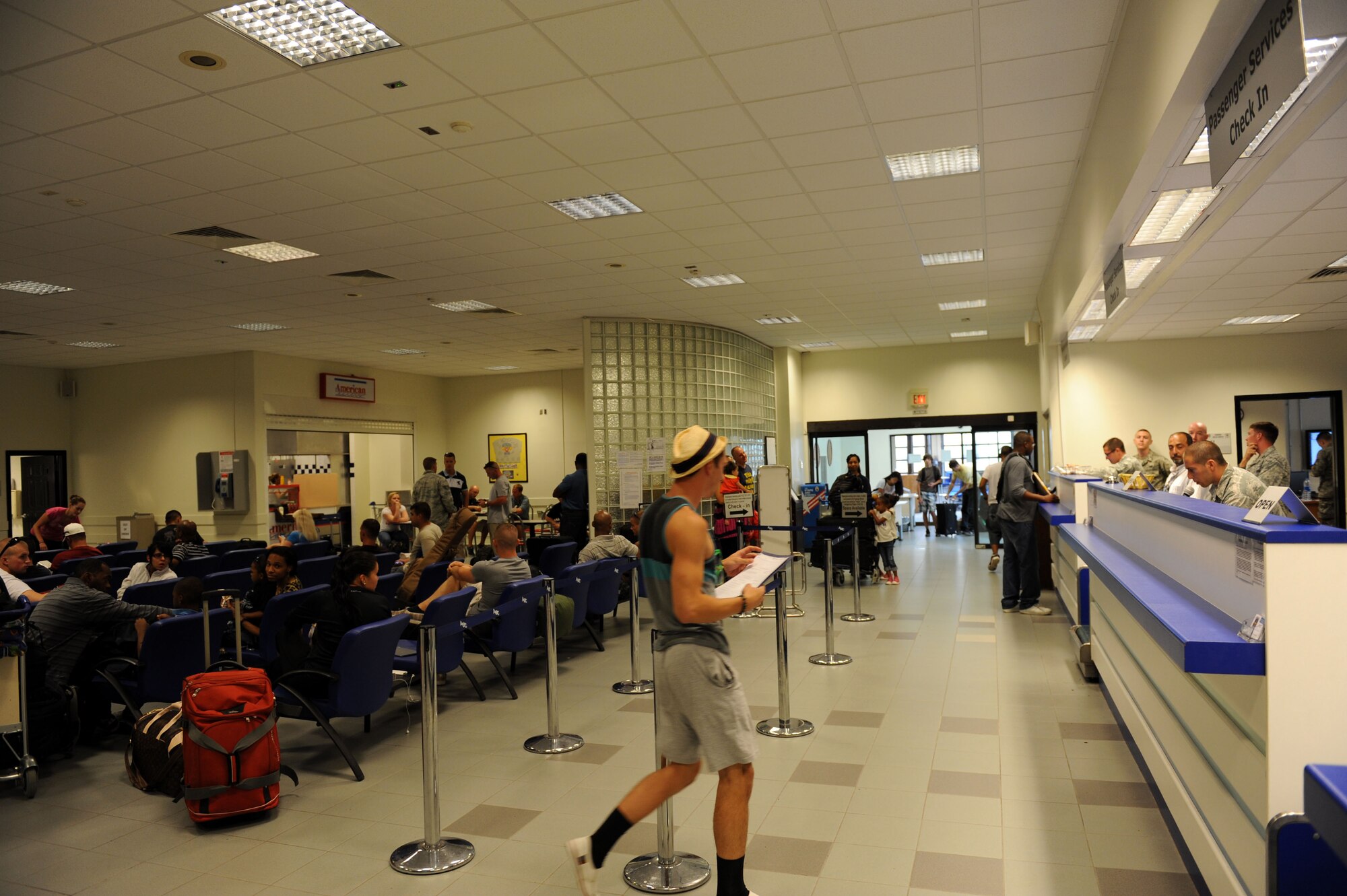 Passengers await their flight at the Incirlik passenger terminal July 10, 2012, at Incirlik Air Base, Turkey. The 728th Air Mobility Squadron operates the passenger terminal and is at the front line of efforts to deliver service members and lifesaving cargo to several key locations across Eastern Europe, Southwest and Central Asia, and parts of Northern Africa. (U.S. Air Force photo by Senior Airman Jarvie Z. Wallace/Released)
