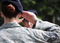 A 919th Special Operations Wing NCO salutes during a recent retreat ceremony at Duke Field, Fla.  Twenty-two reservists at Duke Field will be sporting new stripes to coincide with their July promotions to a higher enlisted rank. (U.S. Air Force photo/Tech. Sgt. Samuel King Jr.)