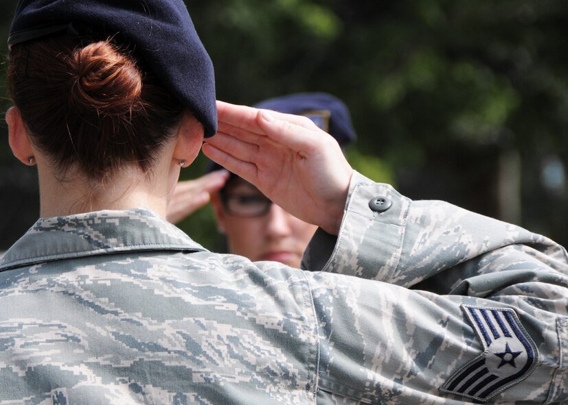 A 919th Special Operations Wing NCO salutes during a recent retreat ceremony at Duke Field, Fla.  Twenty-two reservists at Duke Field will be sporting new stripes to coincide with their July promotions to a higher enlisted rank. (U.S. Air Force photo/Tech. Sgt. Samuel King Jr.)