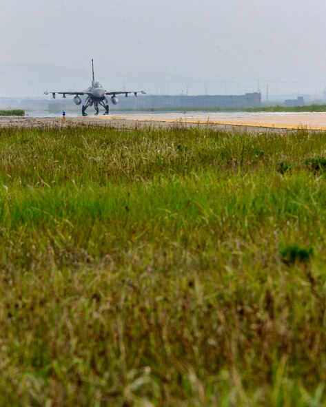 An F-16 taxis towards the flight line preparing for take-off during exercise Beverly Midnight 12-03 on Kunsan Air Base, Republic of Korea, July 9, 2012. The exercise tests the base’s deployment and operational readiness and is the first since the base unit compliance inspection. (U.S. Air Force photo/Staff Sgt. Jonathan Fowler)