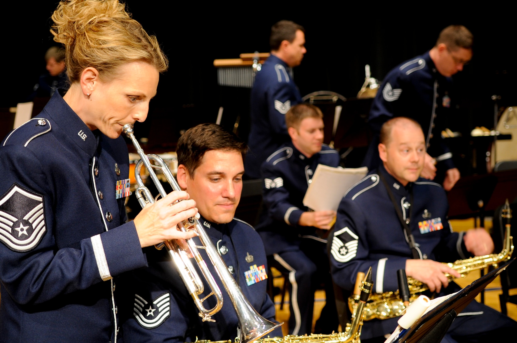 Master Sgt. Carie Cufer of the 555th Air Force Band, tests her pitch with Saxophonist, Tech. Sgt. Brian Bigelow before a concert July 7, 2012. The 555th, commonly known as the Triple Nickel, dating back to 1923, is scheduled to be officially deactivated in 2013, performed its final concert after nearly a century of service to members of the Armed Forces and the nation. (U.S. Air Force photo by Master Sgt. Beth Holliker/Released)