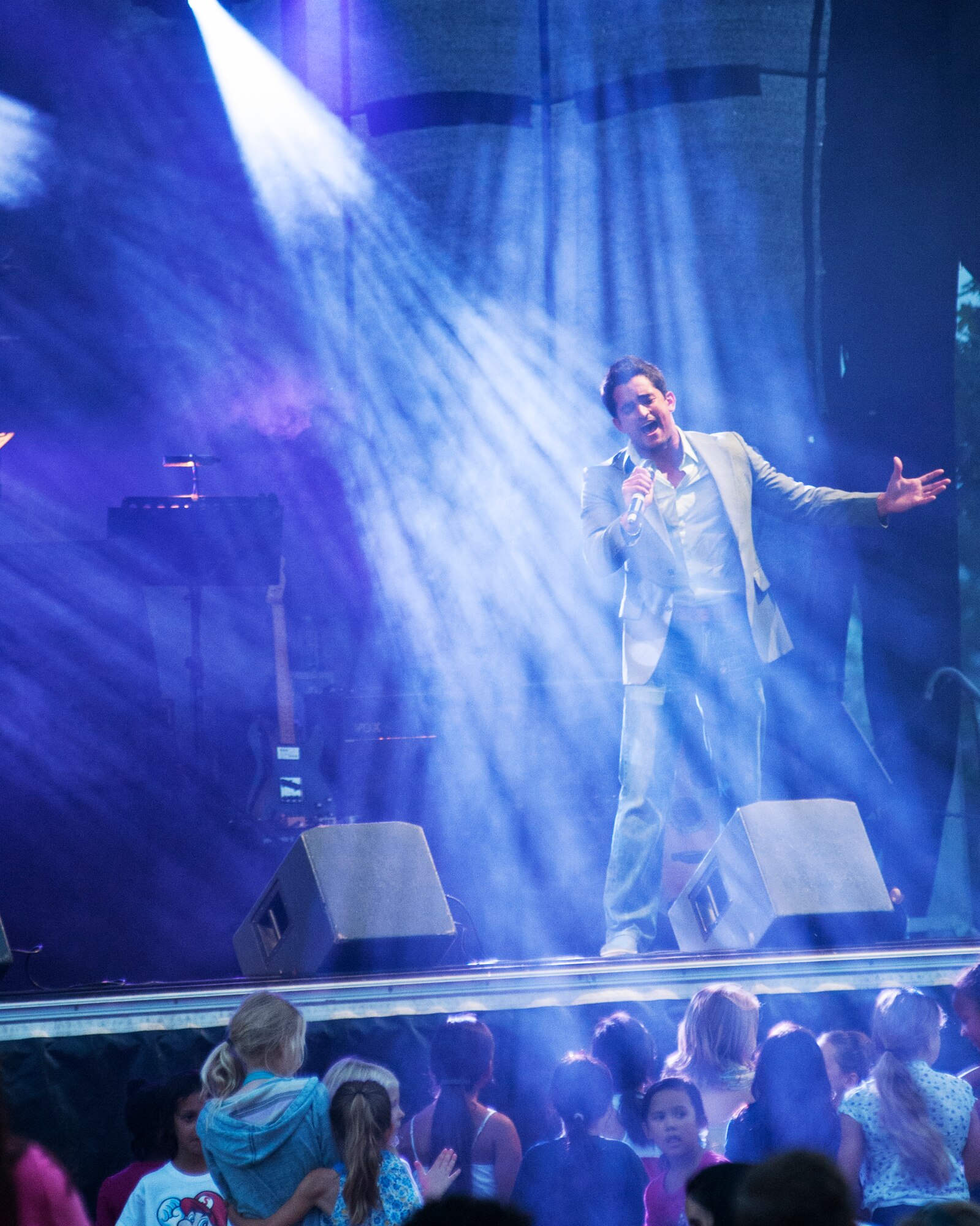 Singer Jovany Javier performs a song during the American Idol Armed Forces concert July 9 at Aviano Air Base, Italy. Javier is part of a two week tour that will perform for military members and their families throughout Europe and Southwest Asia. (U.S. Air Force photo/Airman 1st Class Briana Jones)