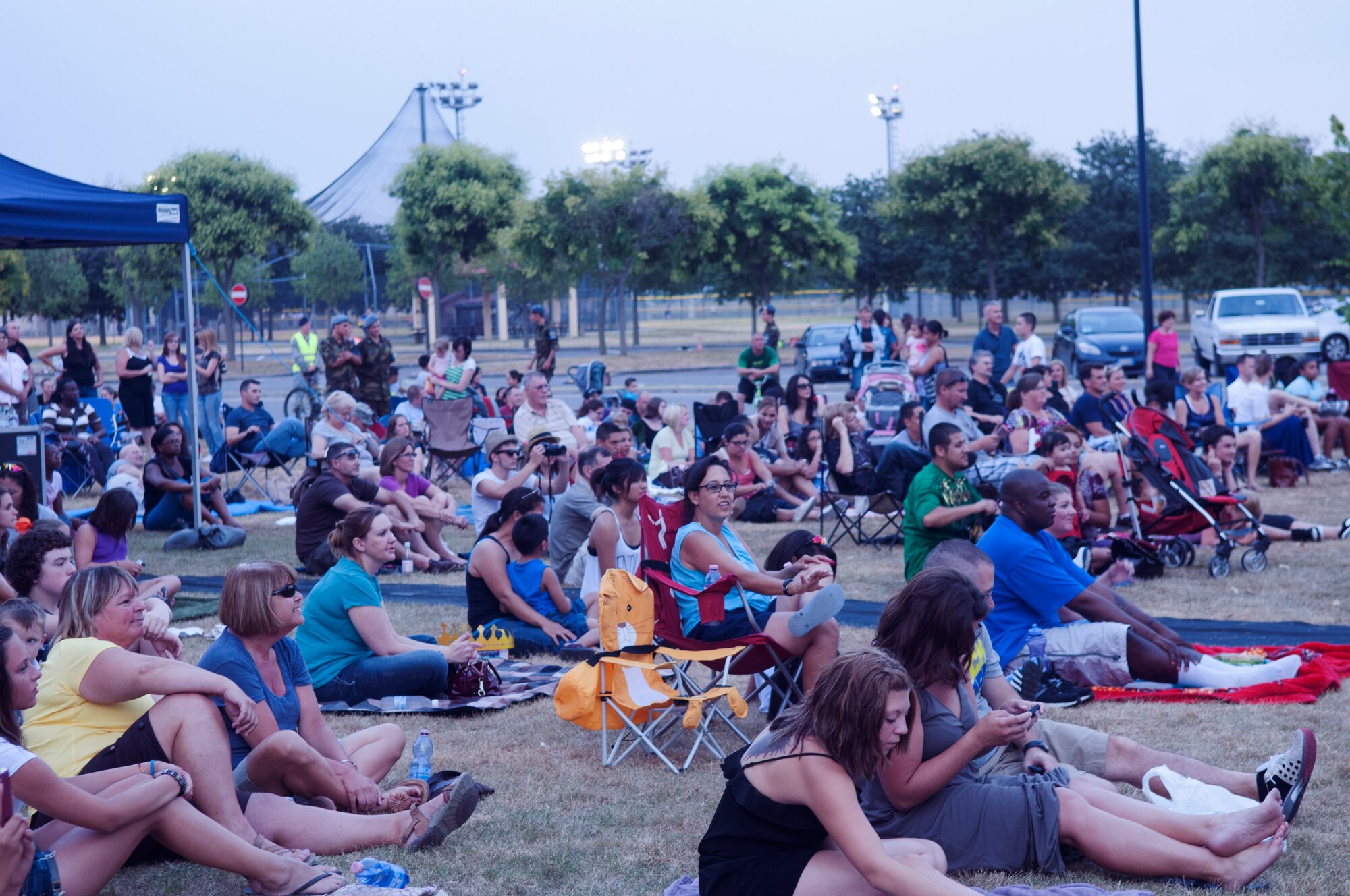 Members of the Aviano community watch the American Idol Armed Forces concert July 9 at Aviano Air Base, Italy. Aviano AB was one of seven stops for the former American Idol contestants to perform for military members and their families. (U.S. Air Force photo/Airman 1st Class Briana Jones)